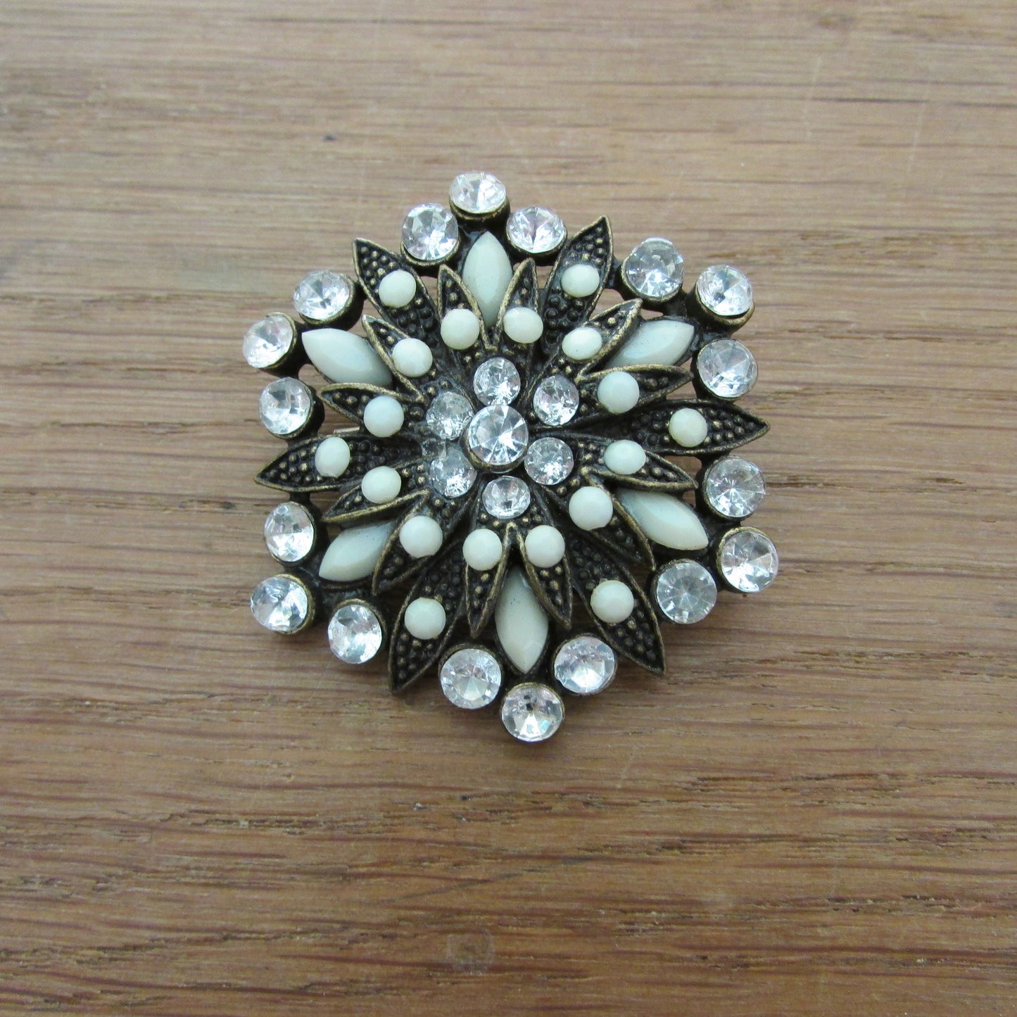 Vintage milk glass & rhinestone circle brooch