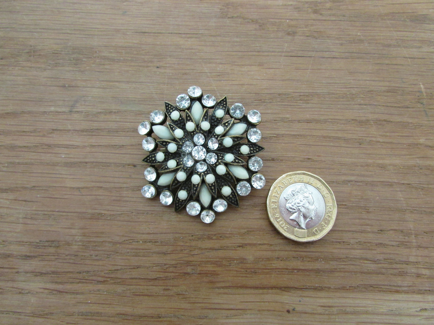 Vintage milk glass & rhinestone circle brooch