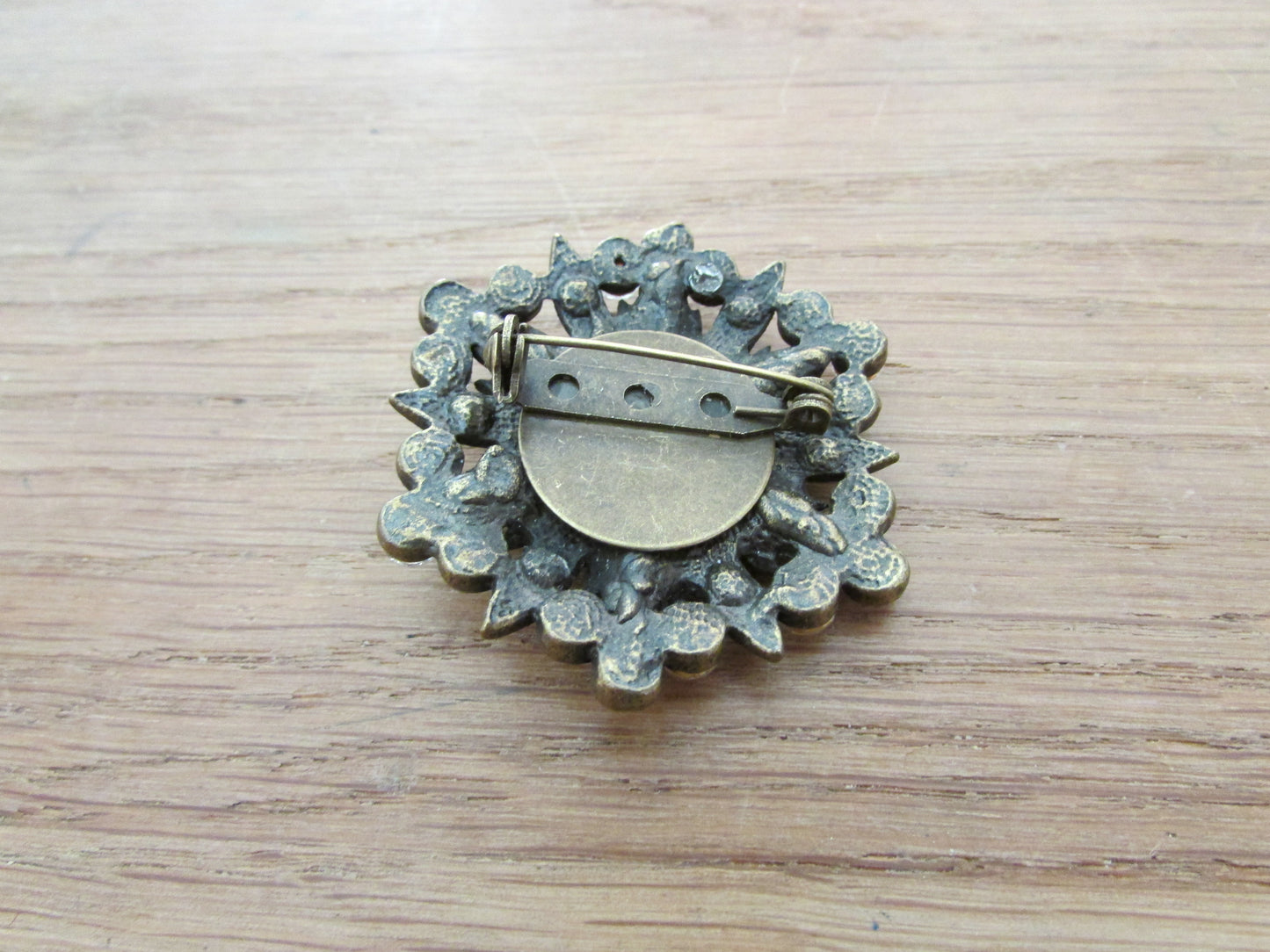 Vintage milk glass & rhinestone circle brooch