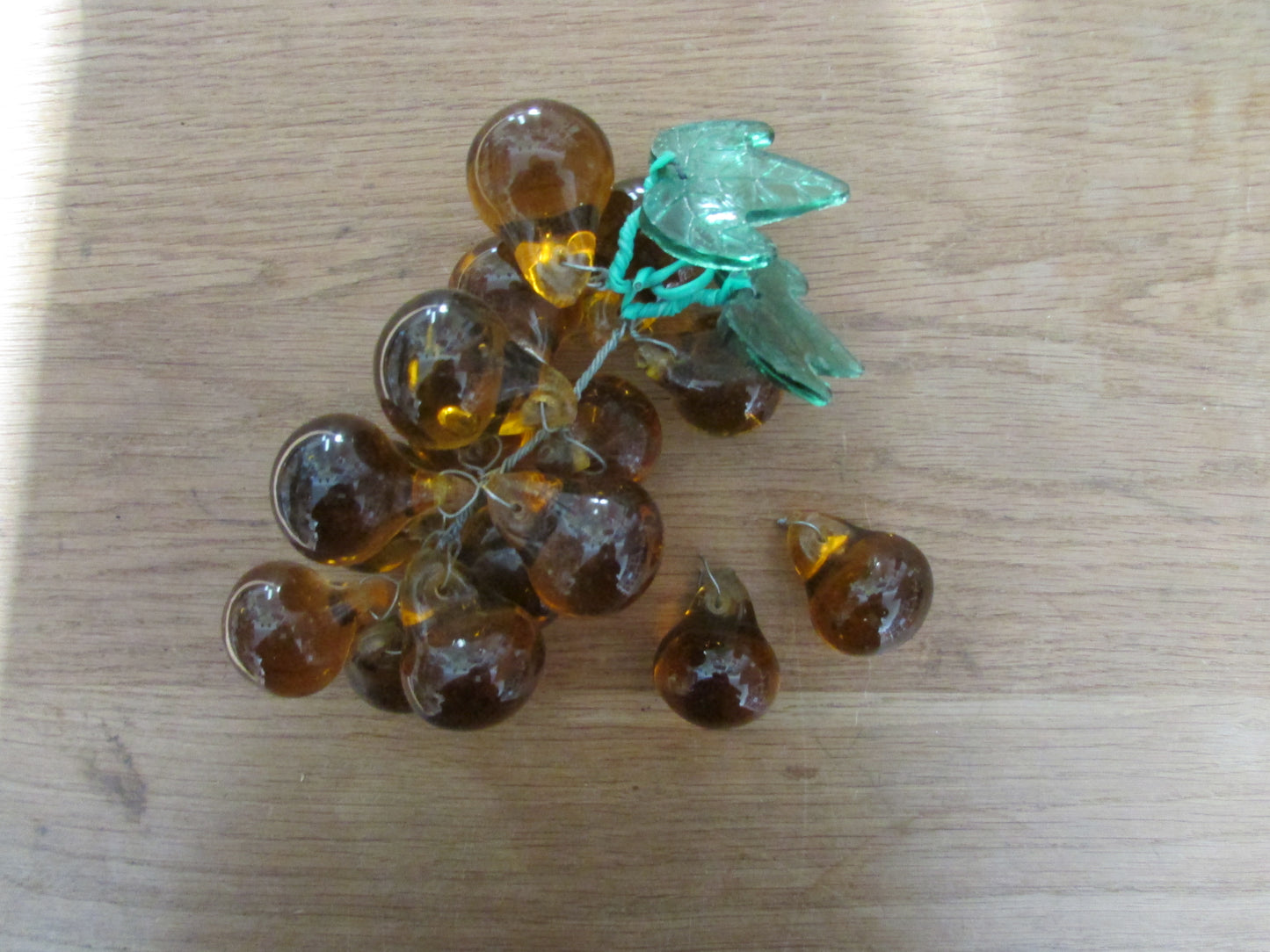 Mid-century Murano-style amber glass large grape cluster with green glass leaves