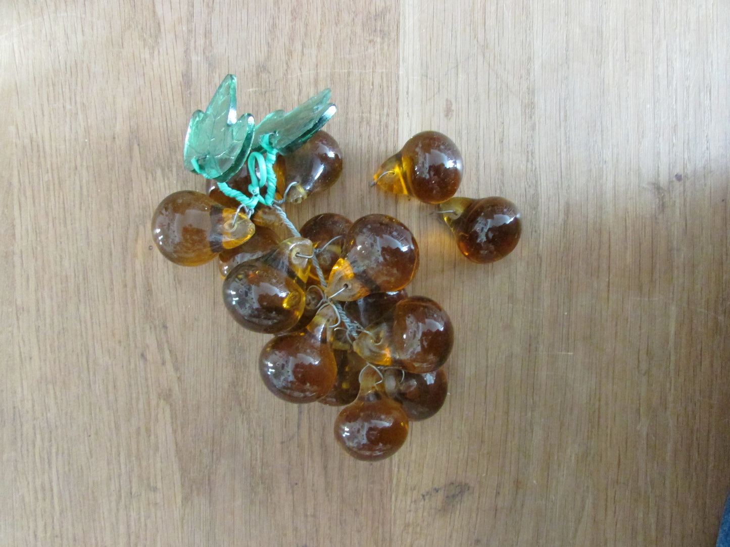 Mid-century Murano-style amber glass large grape cluster with green glass leaves