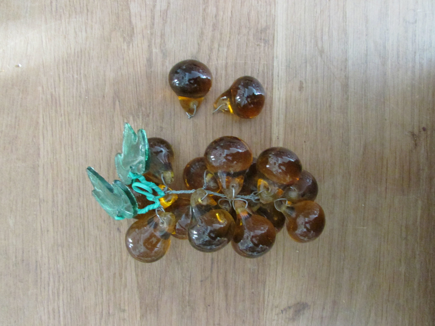 Mid-century Murano-style amber glass large grape cluster with green glass leaves