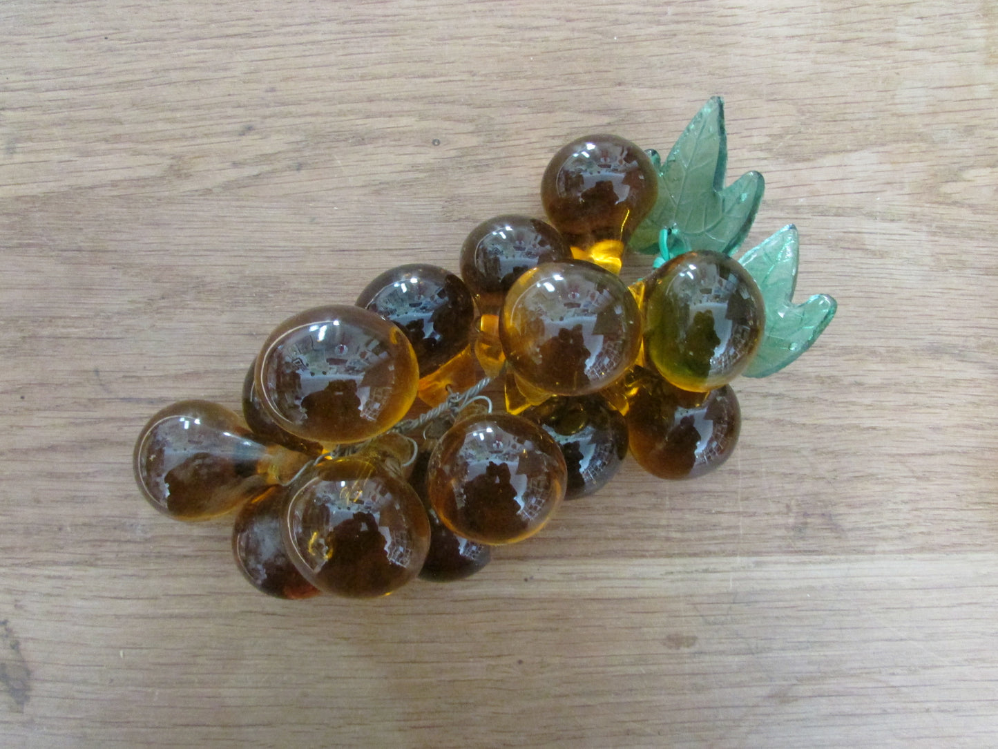 Mid-century Murano-style amber glass large grape cluster with green glass leaves