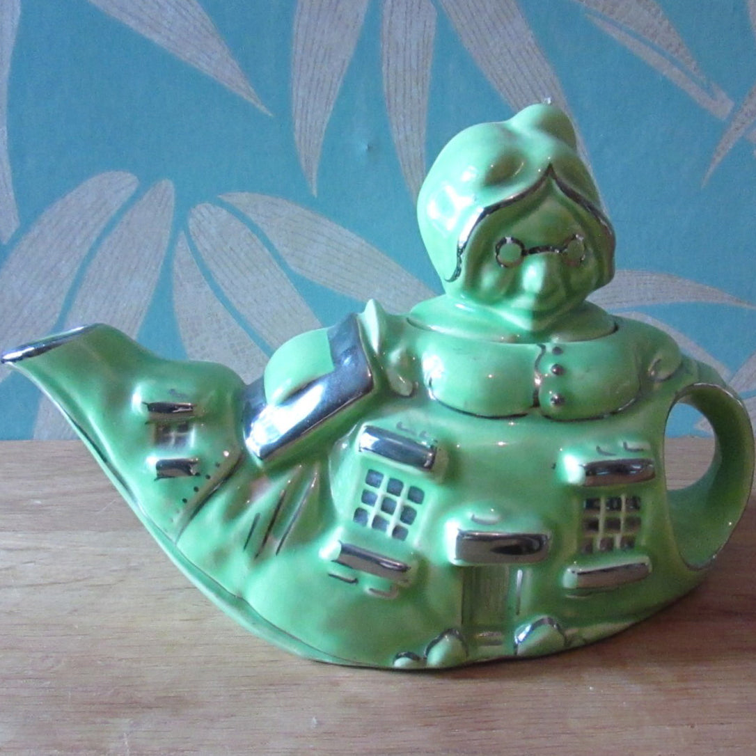 1930s Lingard "Old woman who lived in a shoe" novelty green teapot, silver-finish highlights
