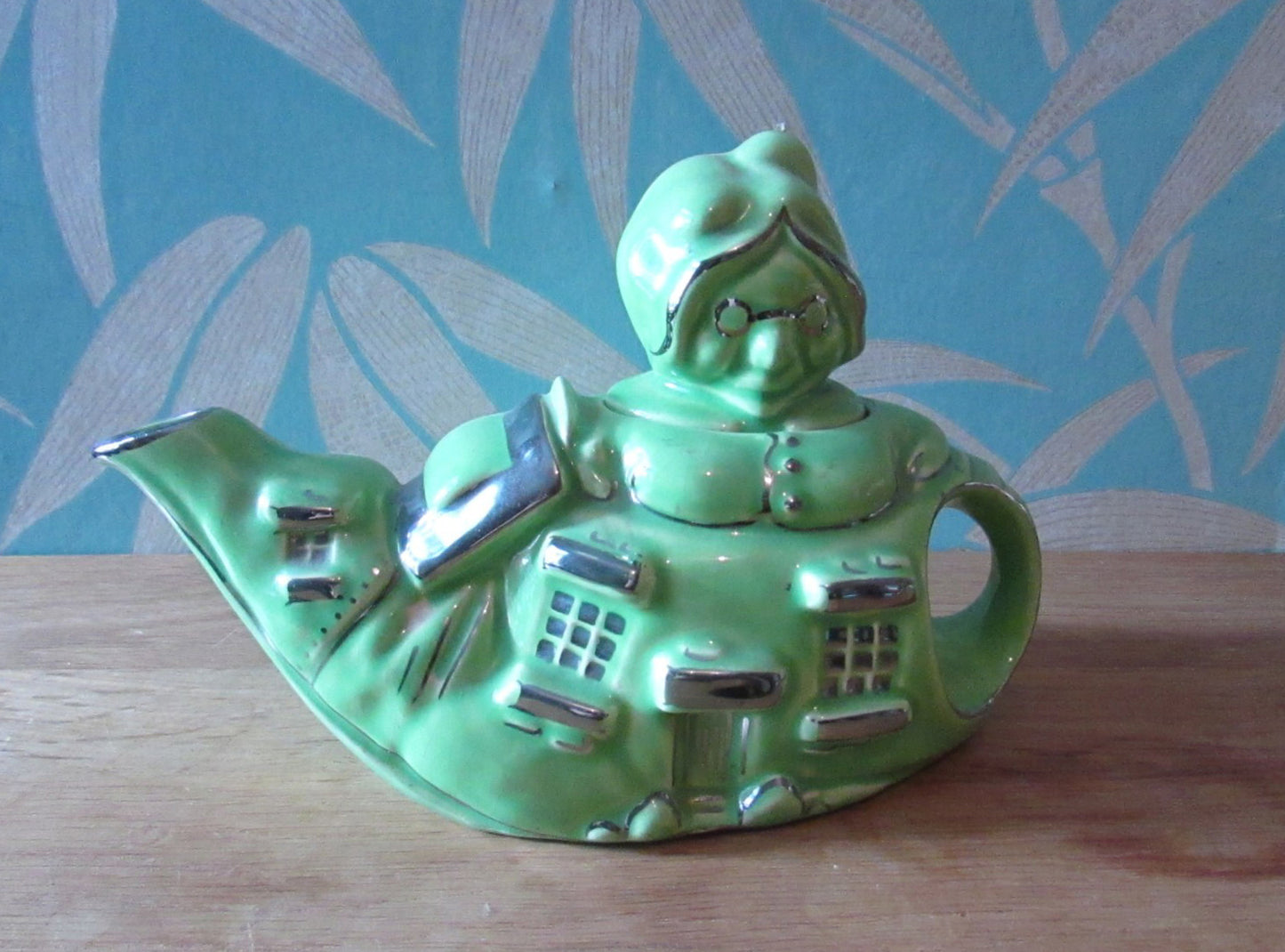 1930s Lingard "Old woman who lived in a shoe" novelty green teapot, silver-finish highlights