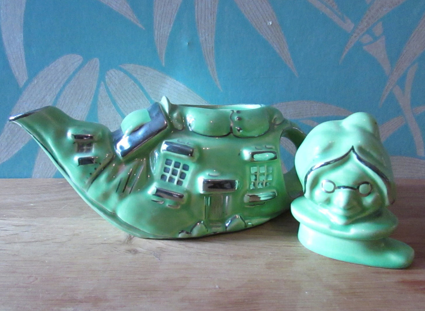 1930s Lingard "Old woman who lived in a shoe" novelty green teapot, silver-finish highlights