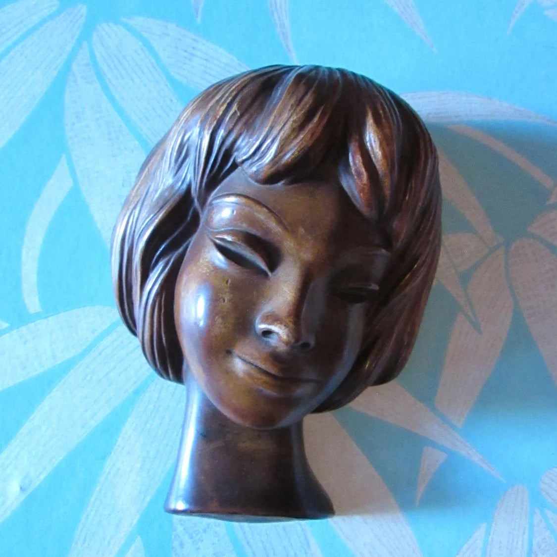 circa. 1960s heavy resin Achatit-style wall mask, smiling girl, made in Germany