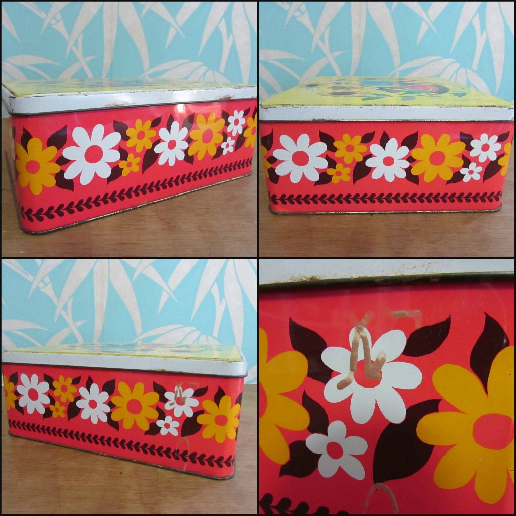 Fun collectable 1960s/70s yellow & orange floral patterned tin, kitsch couple on lid watering sunflowers