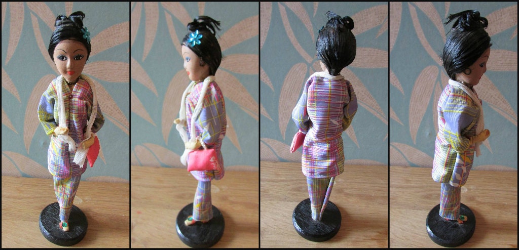 Pair of vintage Singaporean traditional costume souvenir/folk pose dolls