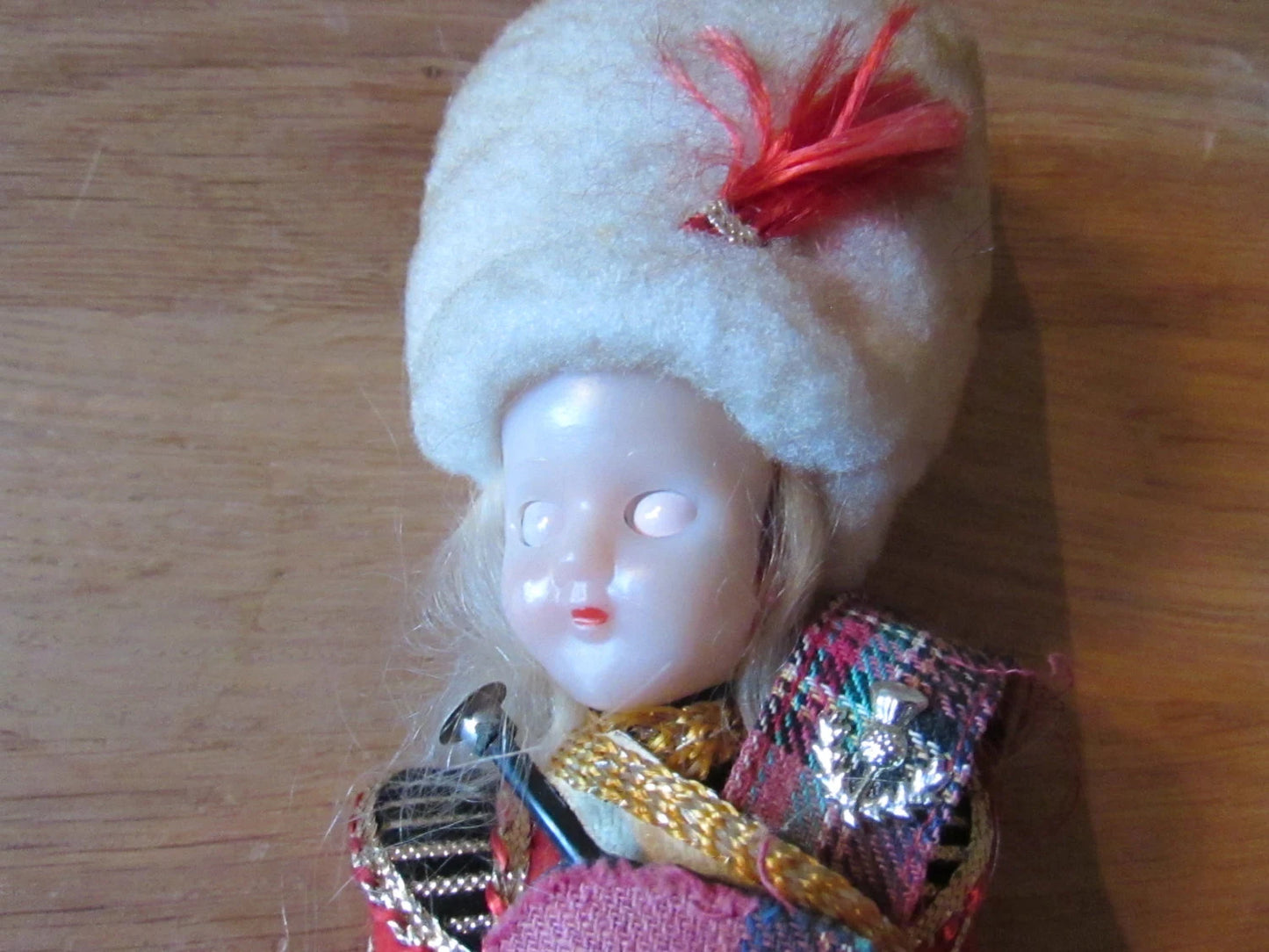 Vintage Scotsman celluloid souvenir doll with open/close eyes, "Empire Made"