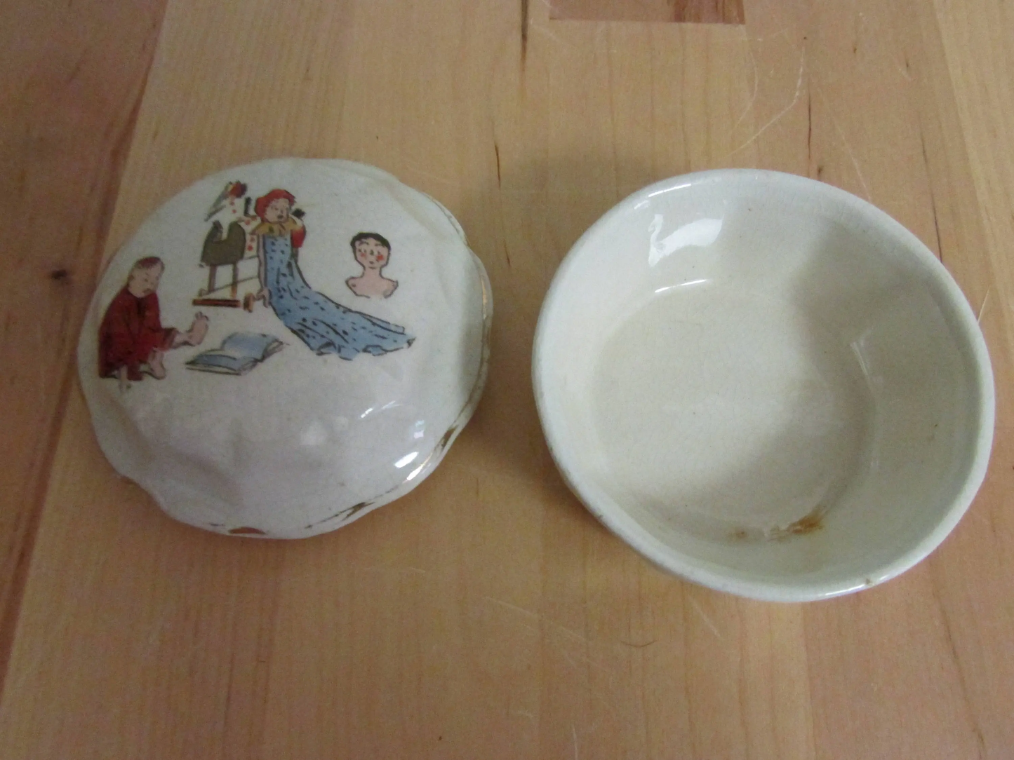 Vintage gilt edged porcelain powder jar with nursery scene transfer detail