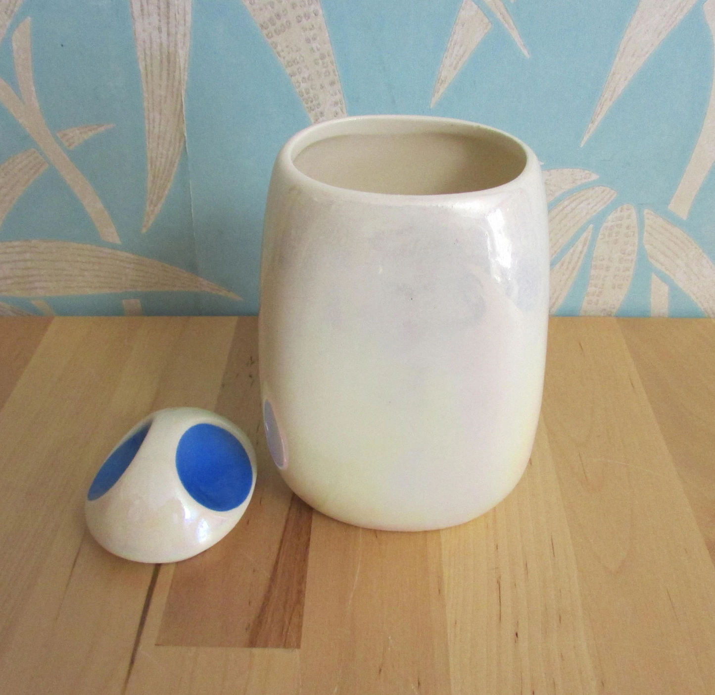Three mid-century Romanian lustred ceramic storage caddies with contrast colour 'pinched' lids