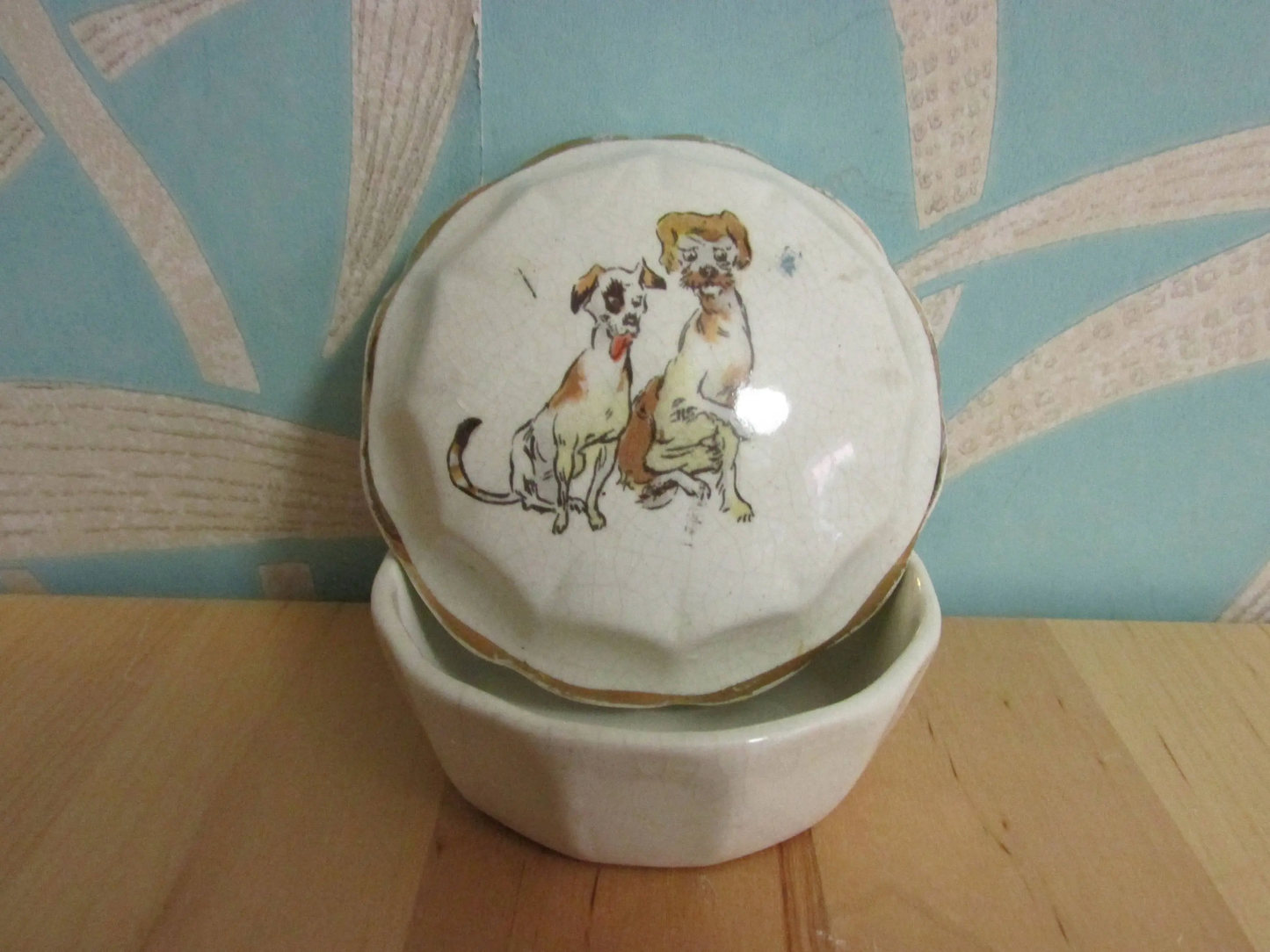 Vintage gilt edged porcelain powder jar with two dogs transfer detail