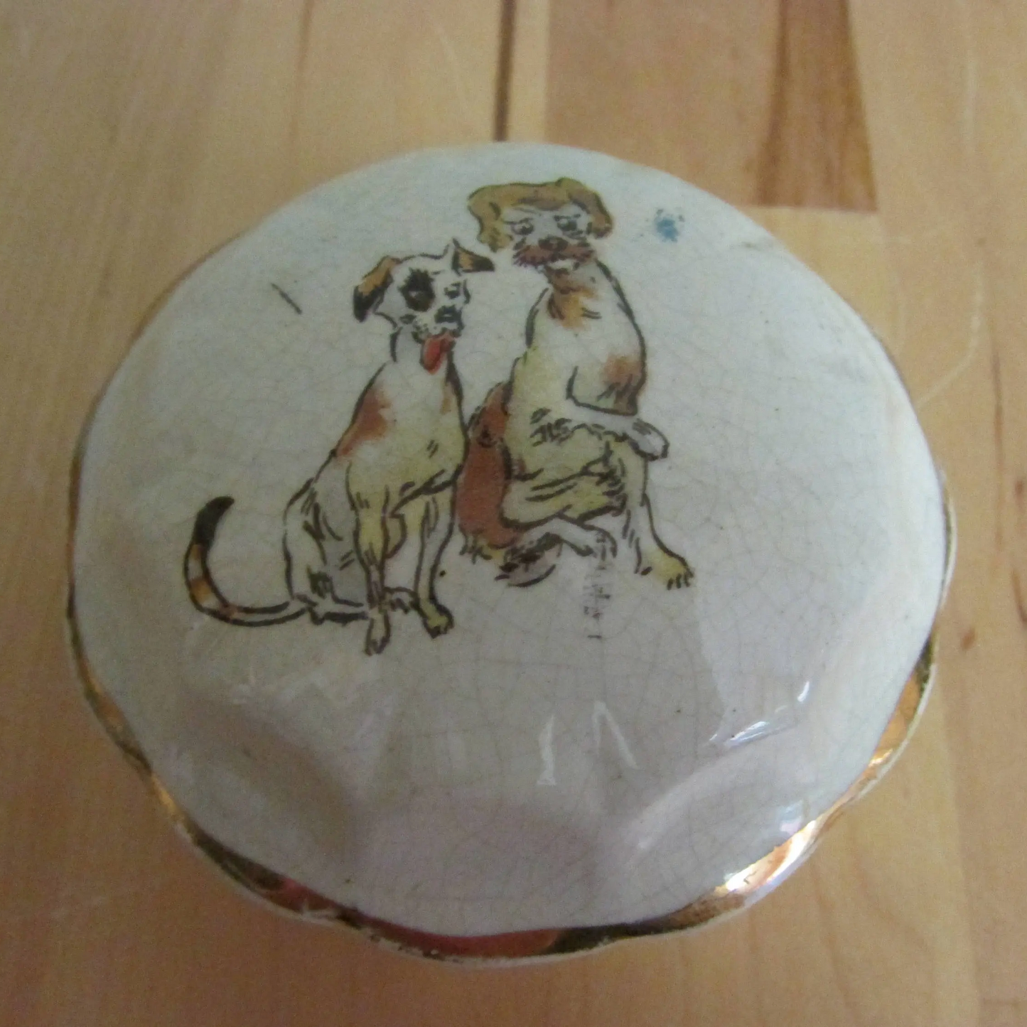 Vintage gilt edged porcelain powder jar with two dogs transfer detail