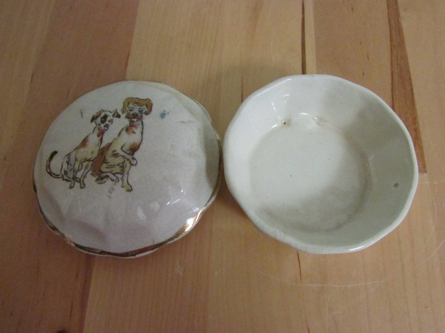 Vintage gilt edged porcelain powder jar with two dogs transfer detail