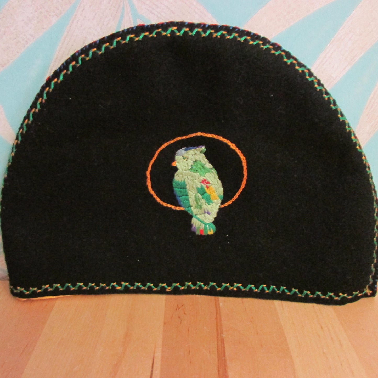 Vintage hand-made two-sided tea cosy with embroidered parrot, & floral edging detail