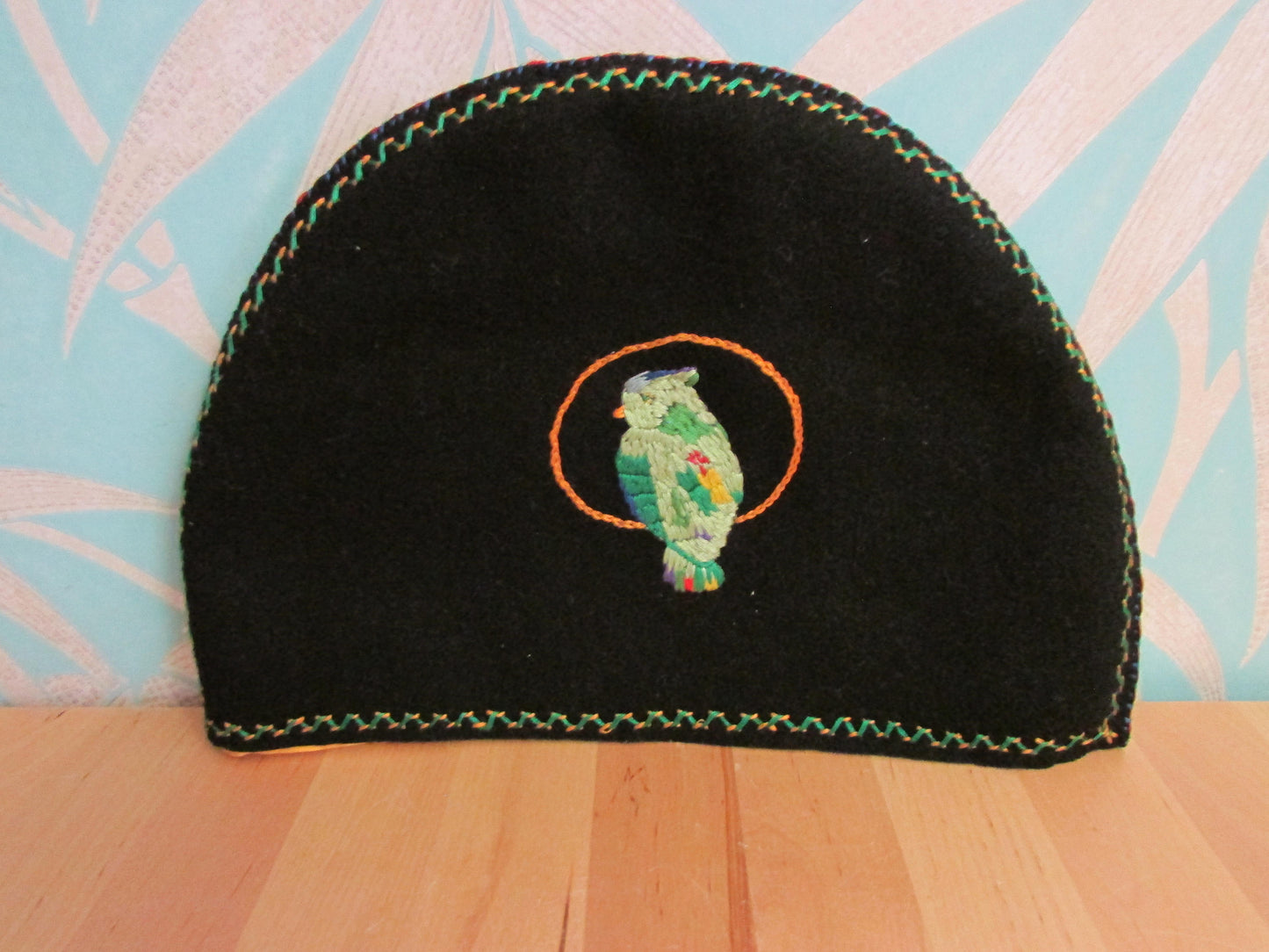 Vintage hand-made two-sided tea cosy with embroidered parrot, & floral edging detail