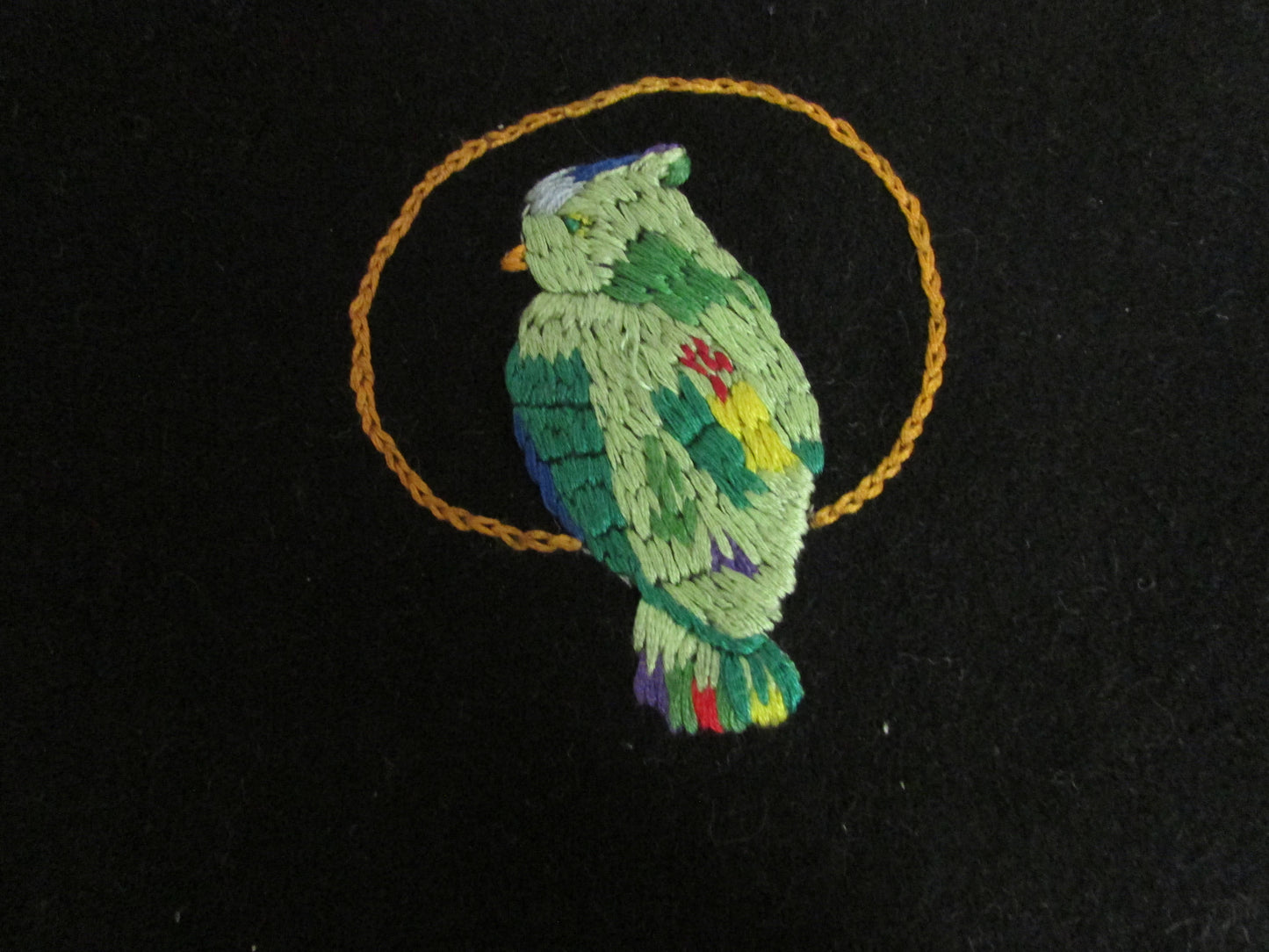 Vintage hand-made two-sided tea cosy with embroidered parrot, & floral edging detail