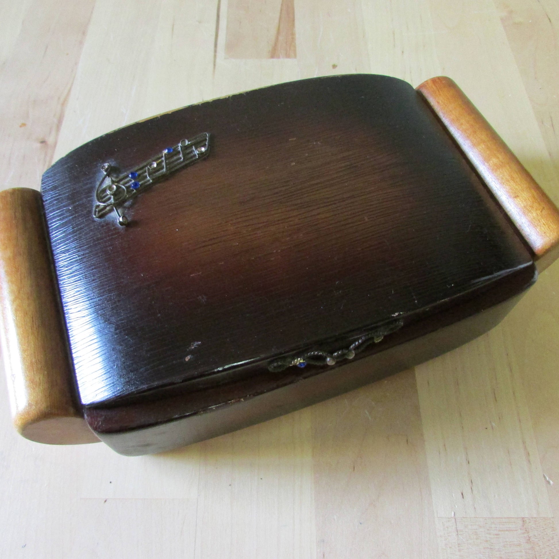 Vintage wooden jewellery/cigarette box, metal-tone music staff & notes highlighted with blue rhinestones