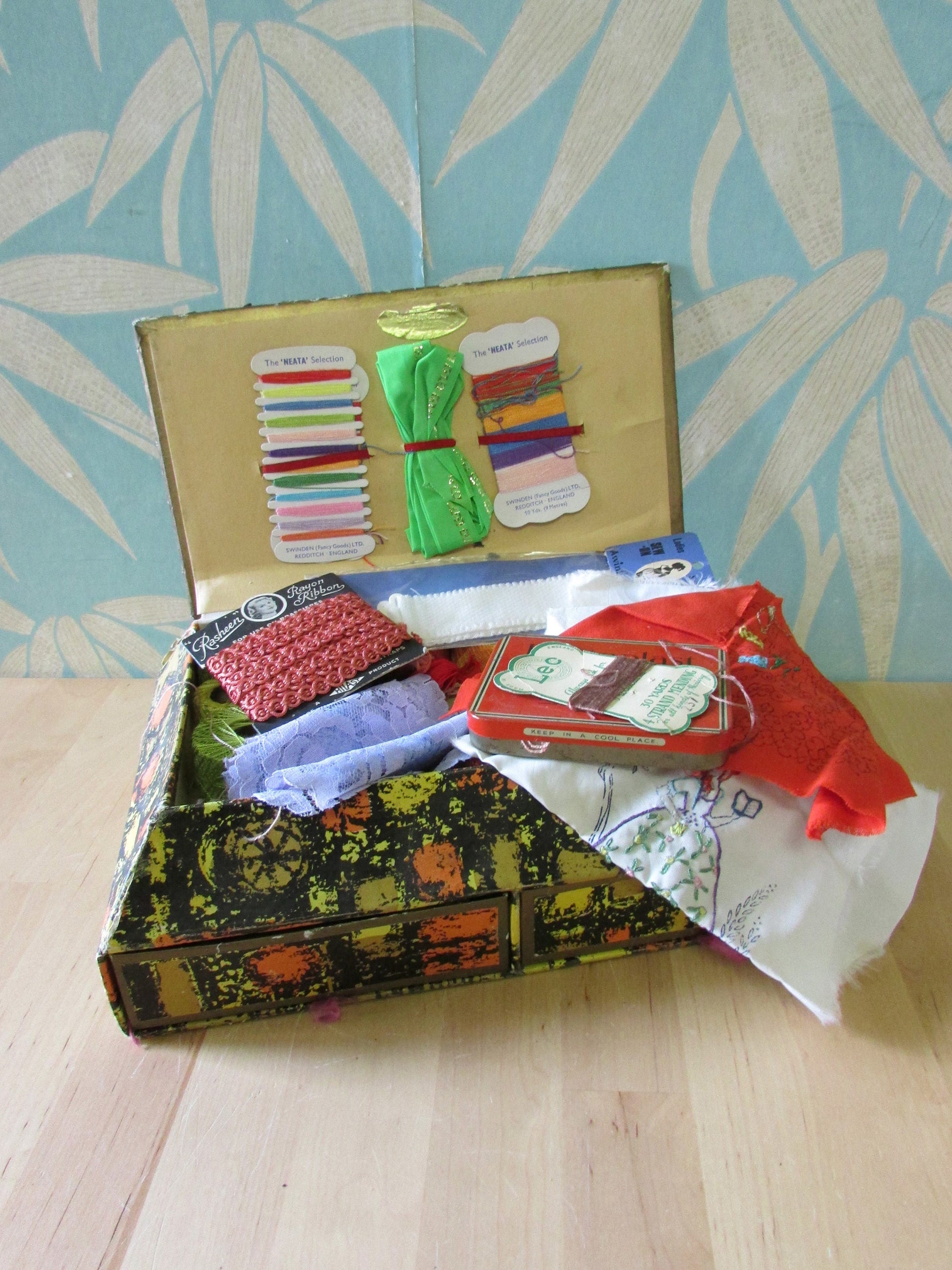 Must-have 1950s Sewinden Products cardboard sewing chest, crammed full with vintage haberdashery