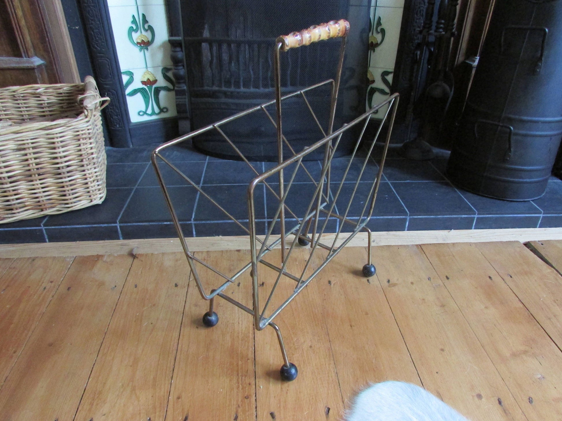 Mid-century metal magazine rack with bamboo handle and ball feet