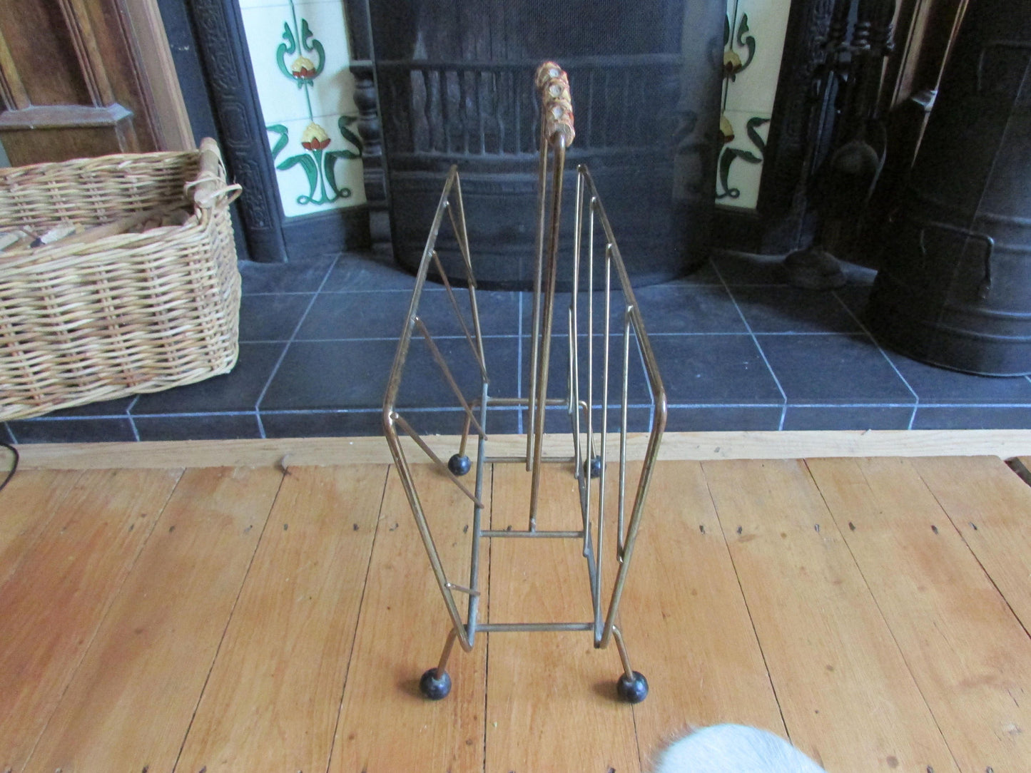 Mid-century metal magazine rack with bamboo handle and ball feet