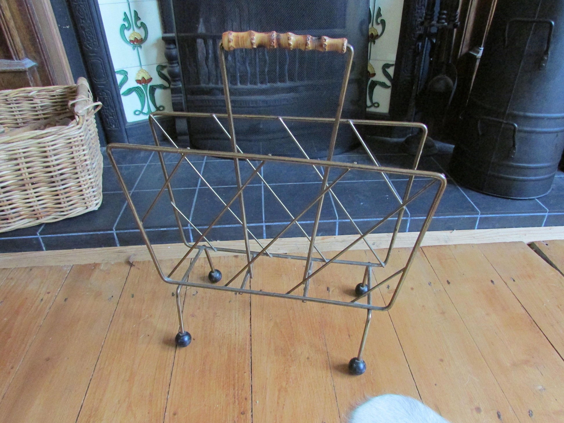 Mid-century metal magazine rack with bamboo handle and ball feet