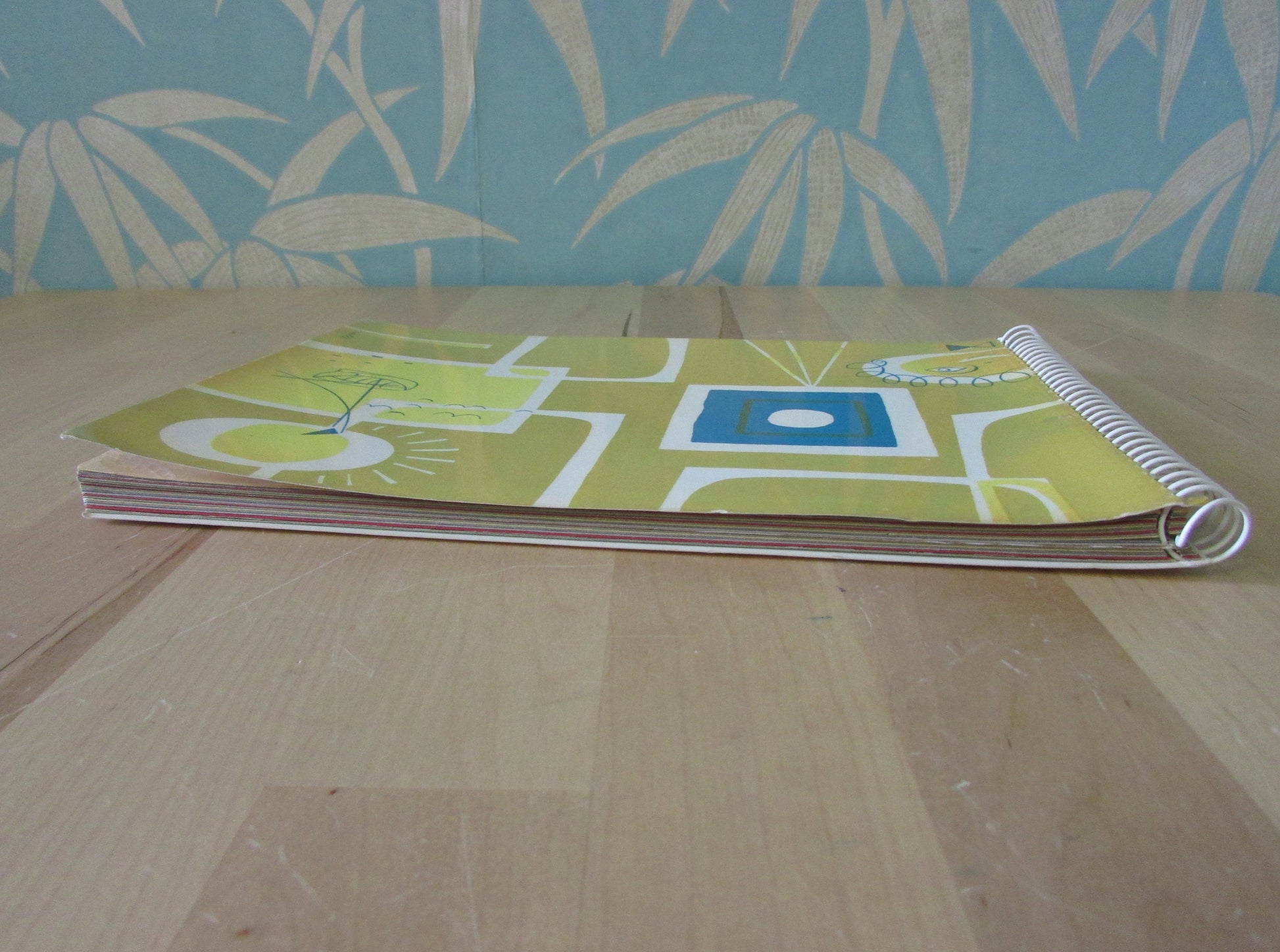 Mid-century photo album, abstract sun & boat motif cover, botanical patterned dividing sheets