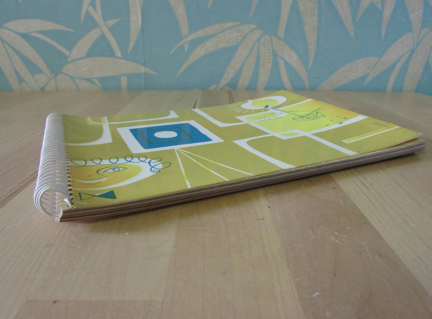 Mid-century photo album, abstract sun & boat motif cover, botanical patterned dividing sheets