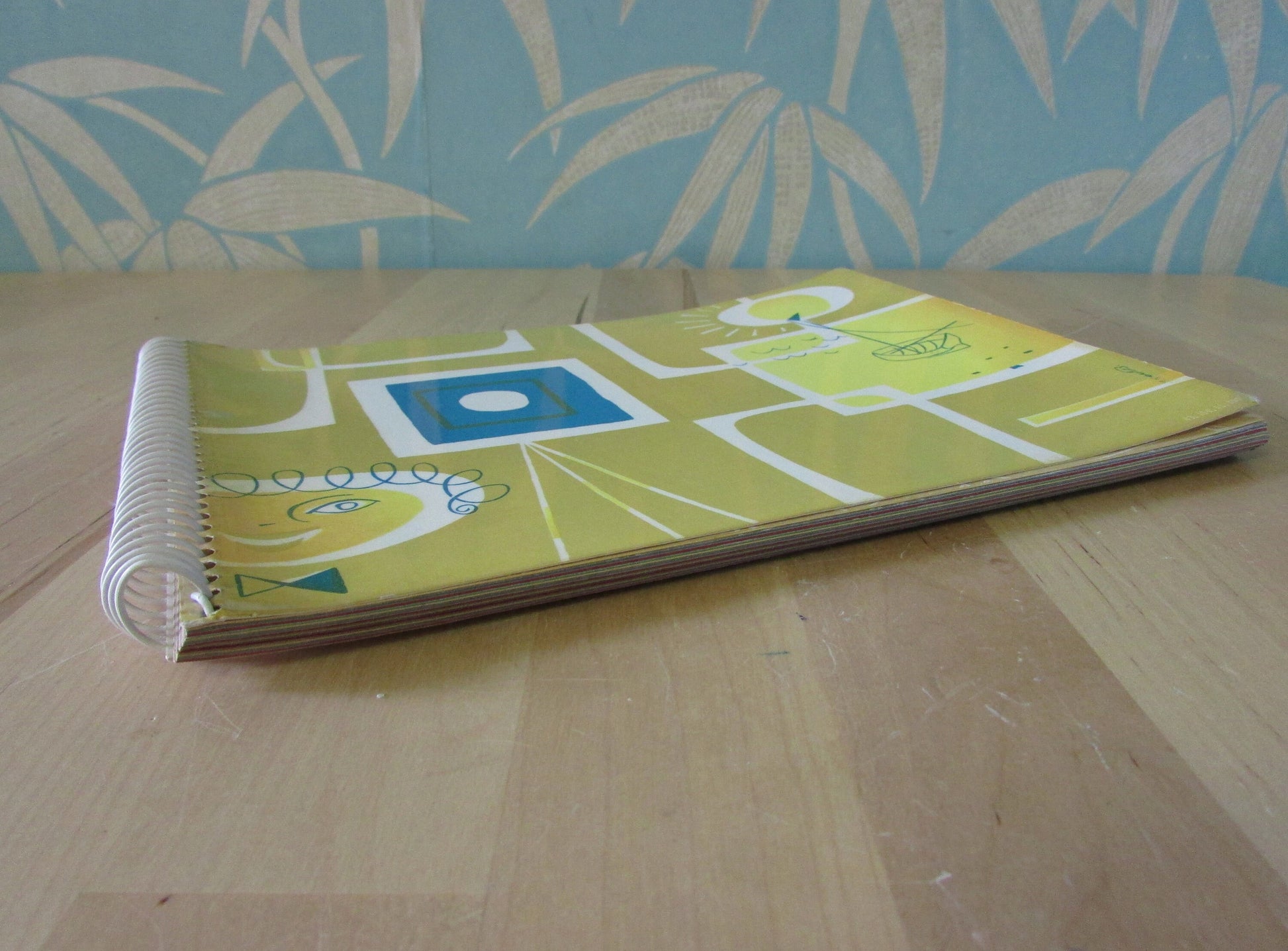 Mid-century photo album, abstract sun & boat motif cover, botanical patterned dividing sheets