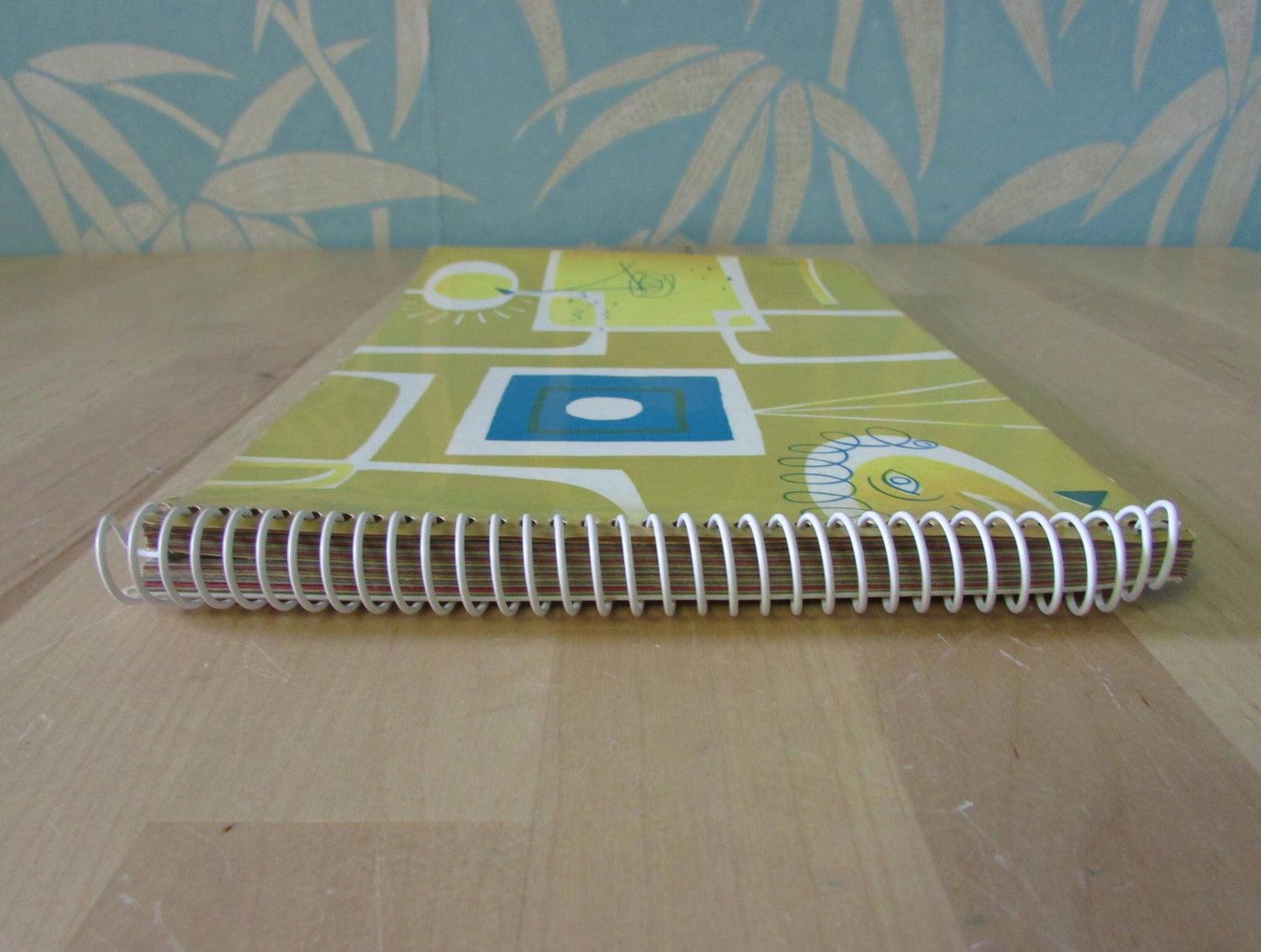Mid-century photo album, abstract sun & boat motif cover, botanical patterned dividing sheets