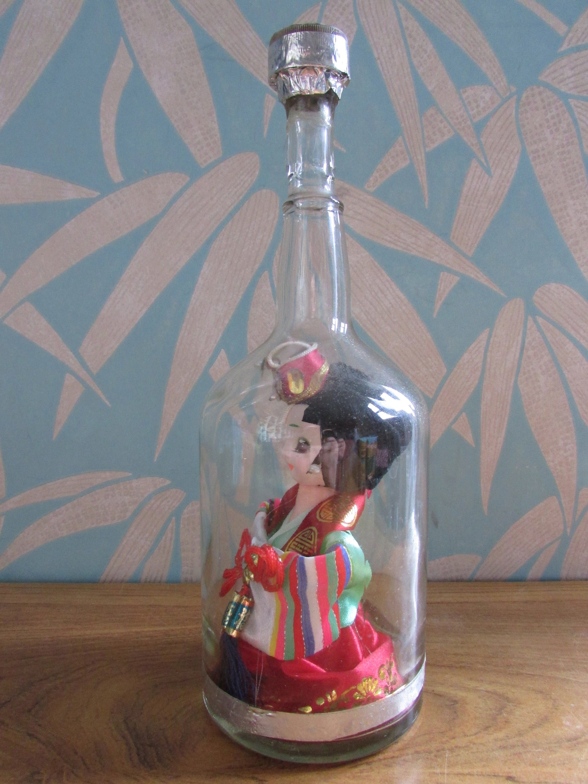 Quirky 'bottled' vintage Korean souvenir doll in traditional bridal dress