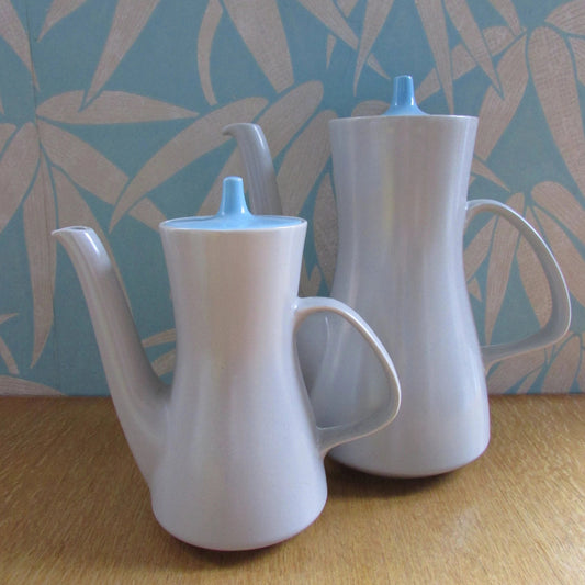 Pair of mid-century Poole Pottery ceramic Twintone contour coffee pots, Sky Blue & Dove Grey