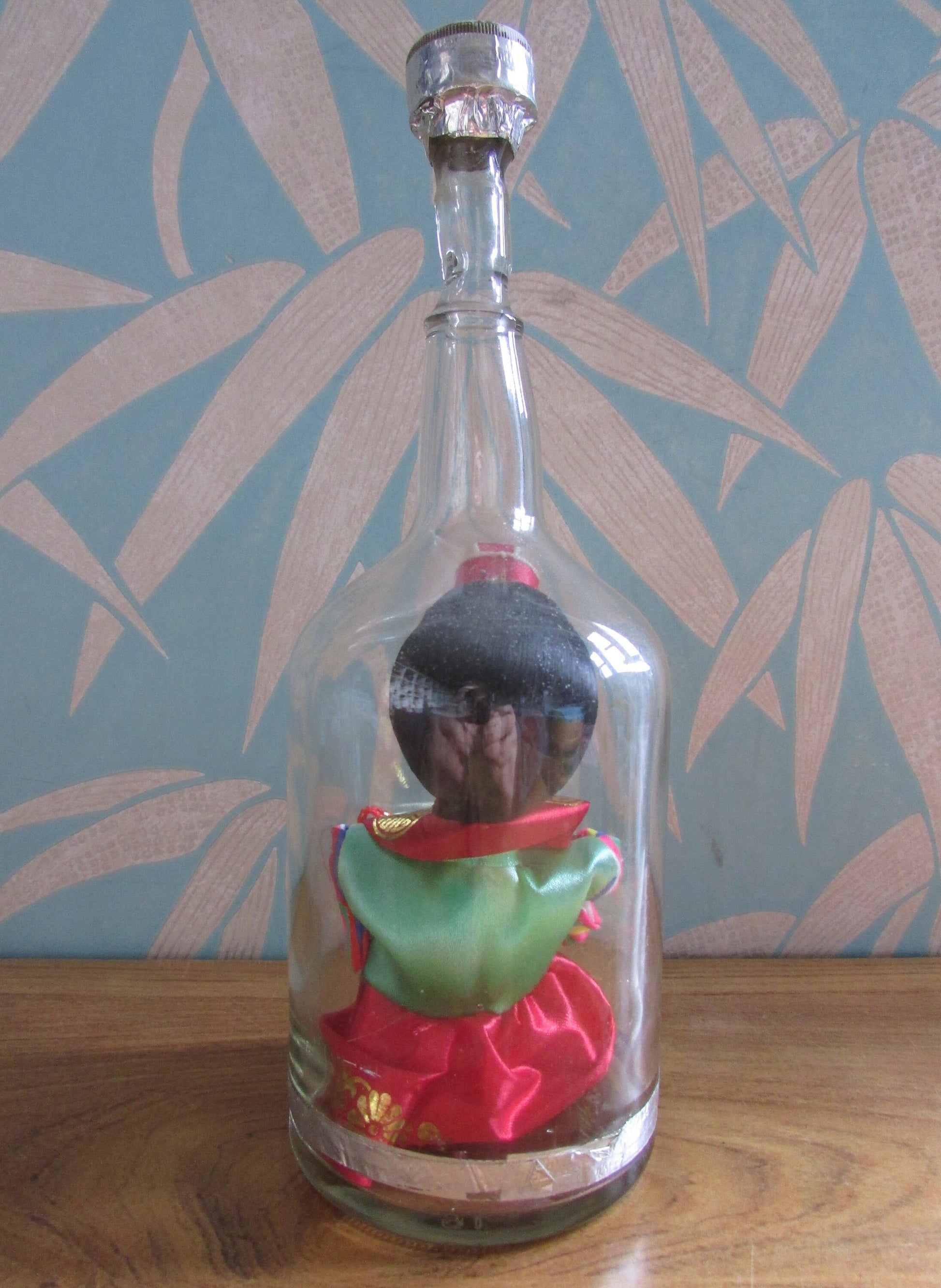 Quirky 'bottled' vintage Korean souvenir doll in traditional bridal dress
