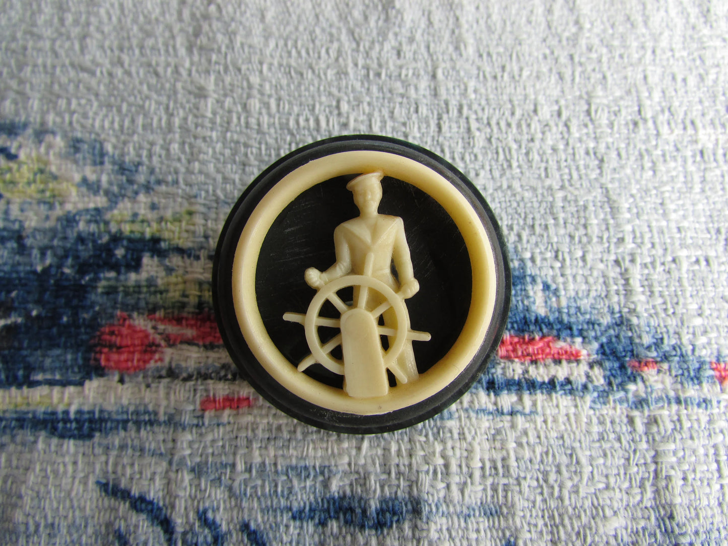 Home-made brooch using vintage plastic cocktail stirrer and vintage button