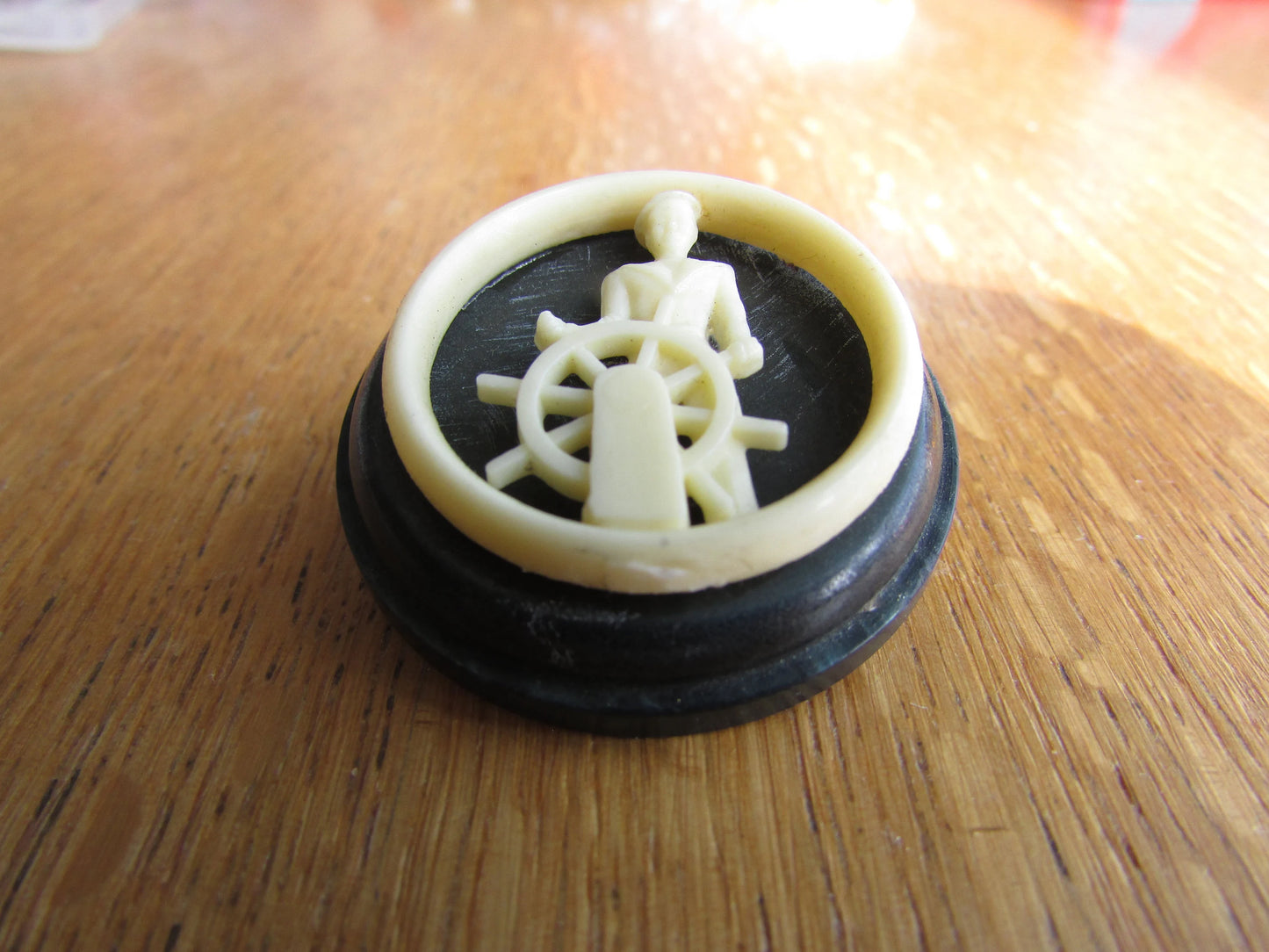 Home-made brooch using vintage plastic cocktail stirrer and vintage button