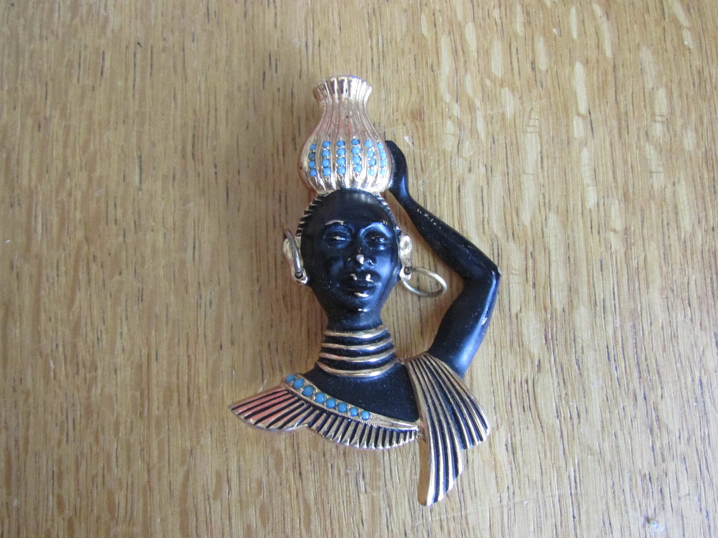 Mid-century blackamoor tribal bust brooch with turquoise seed bead accents
