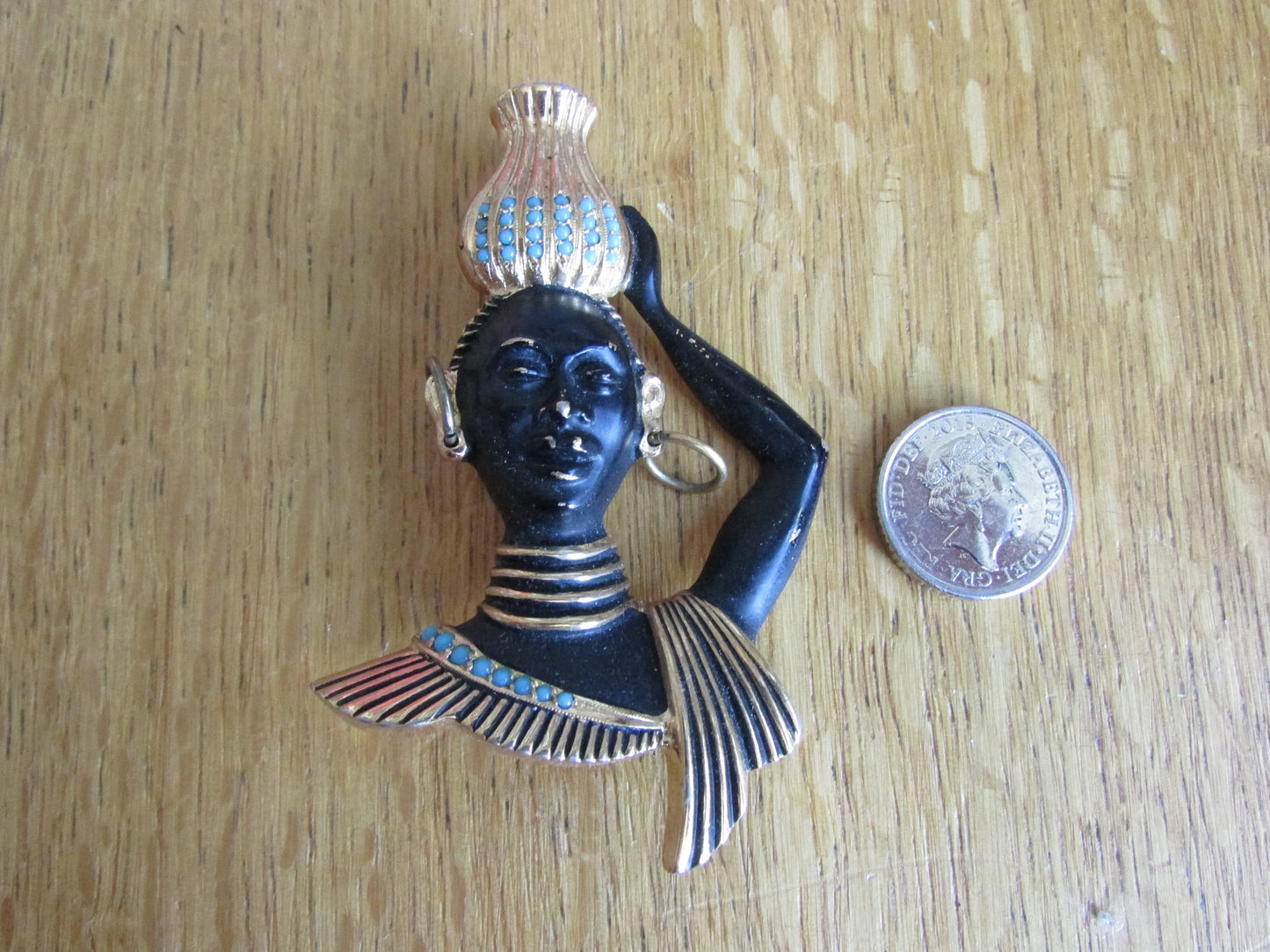Mid-century blackamoor tribal bust brooch with turquoise seed bead accents