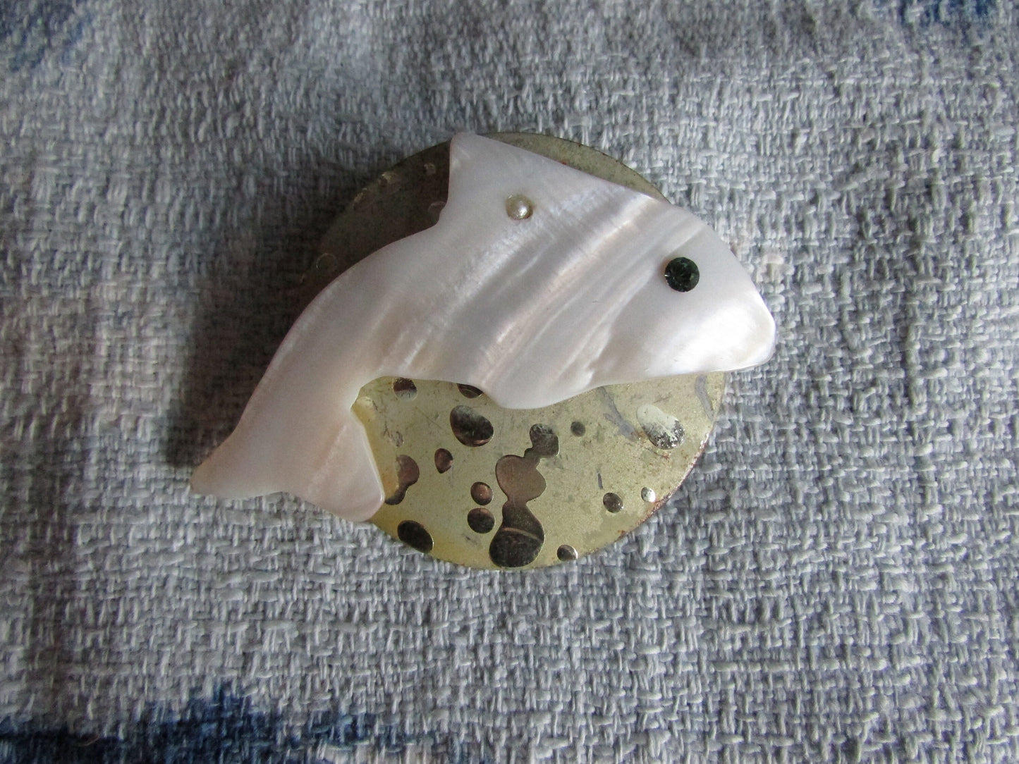 Home-made brooch using vintage Mother of Pearl fish and metal patterned disc earring back
