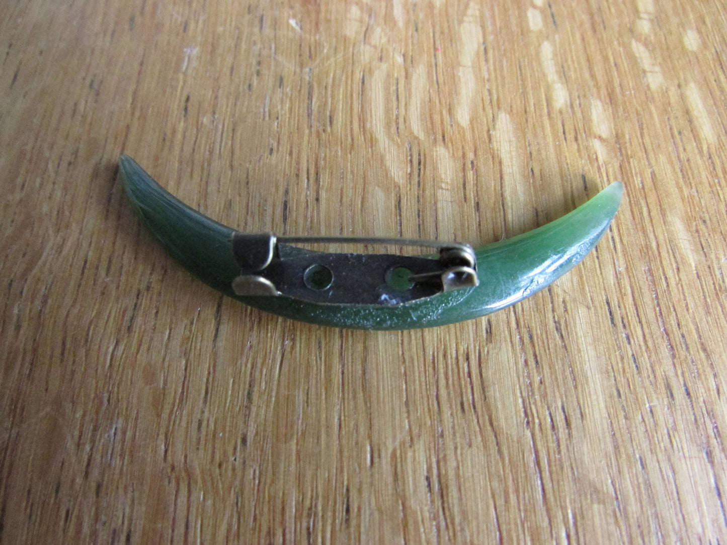 Home-made brooch using vintage carved jade crescent