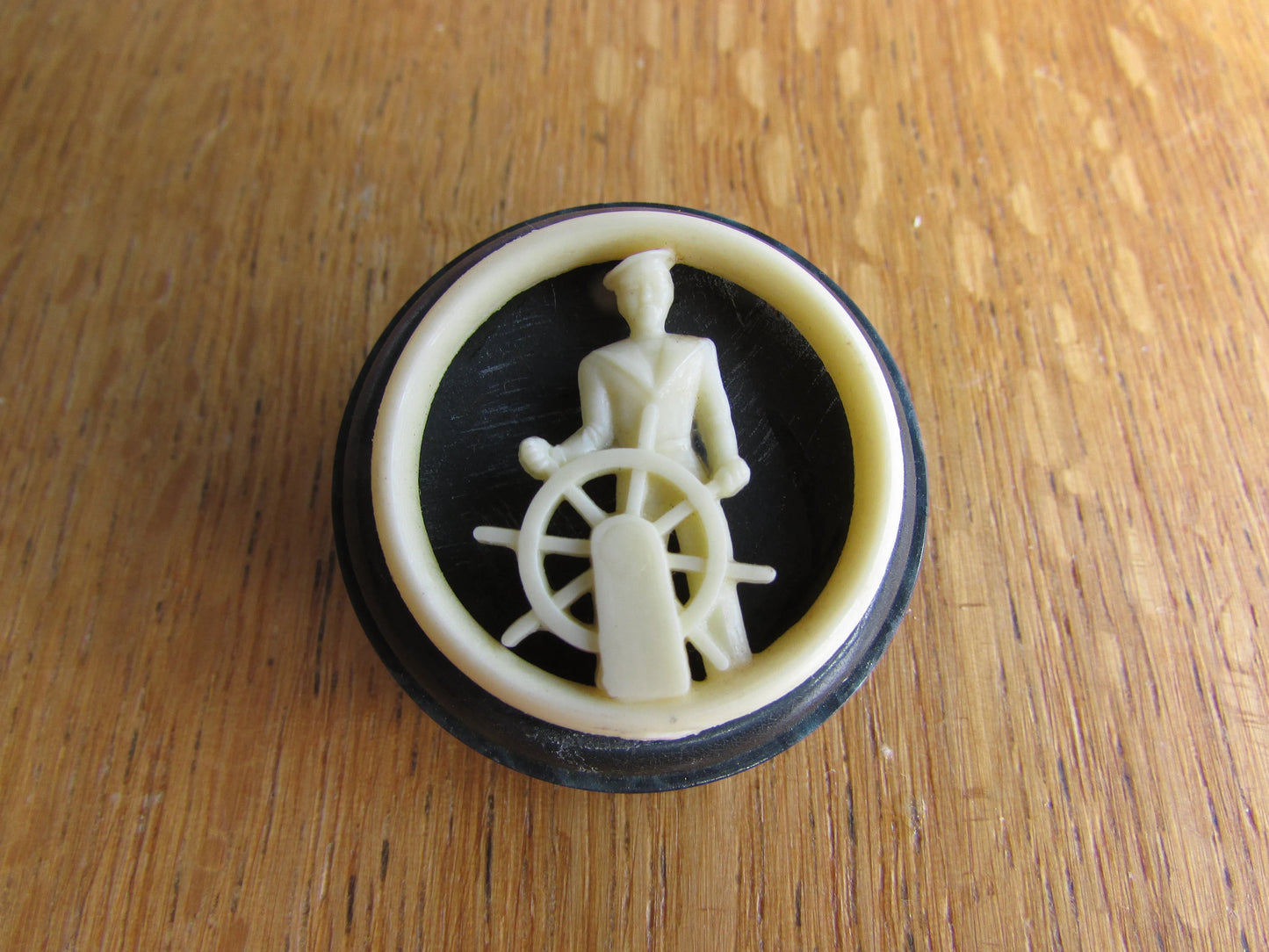 Home-made brooch using vintage plastic cocktail stirrer and vintage button