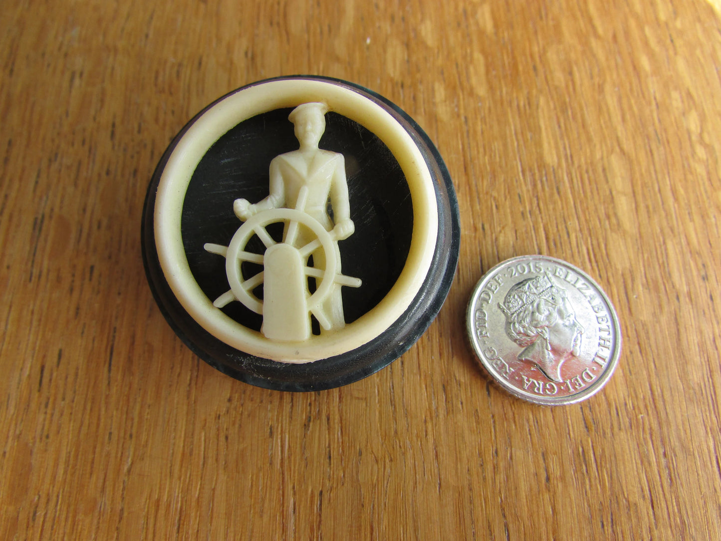 Home-made brooch using vintage plastic cocktail stirrer and vintage button