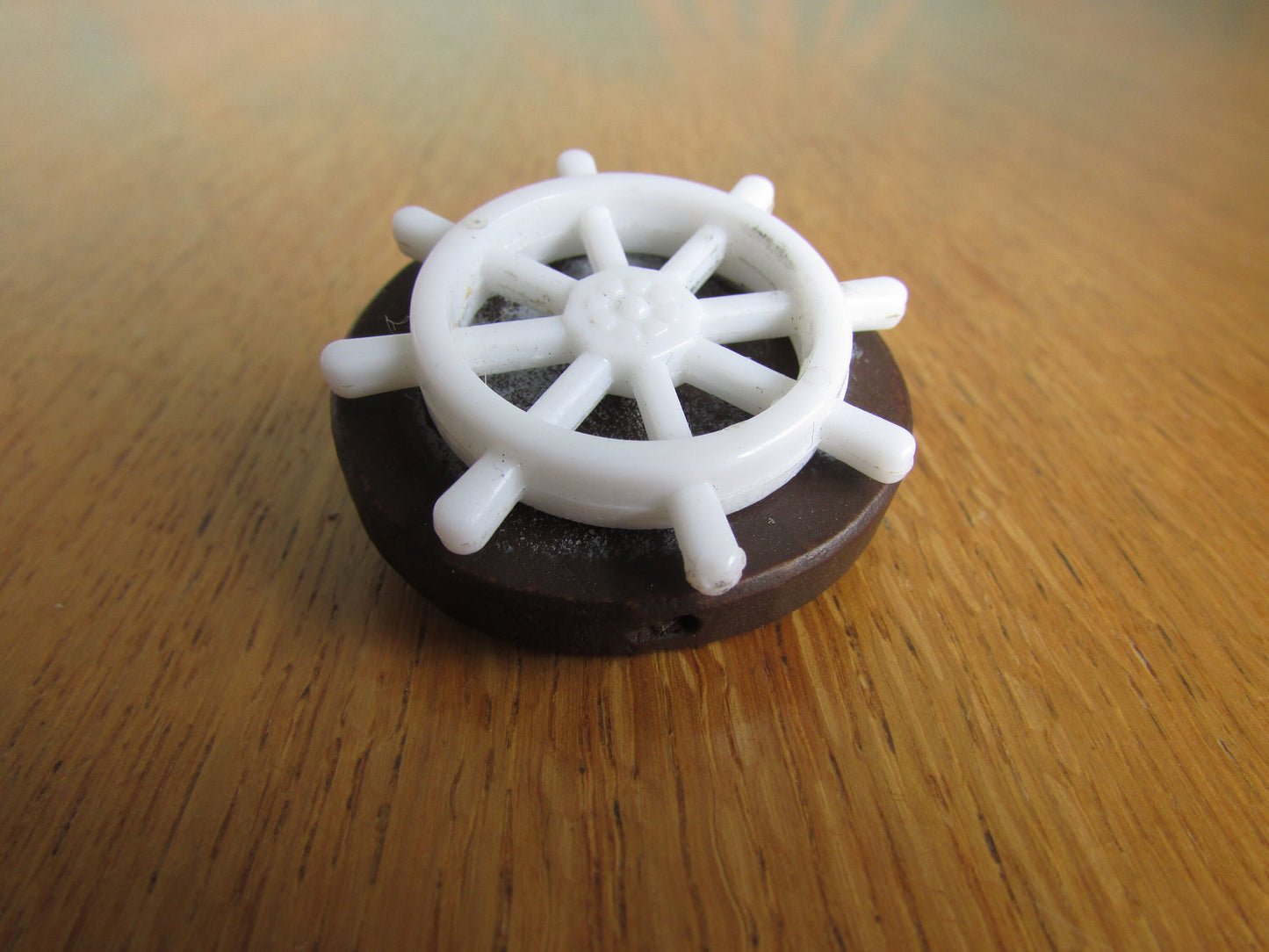 Home-made brooch using vintage plastic ships wheel and vintage wooden round bead