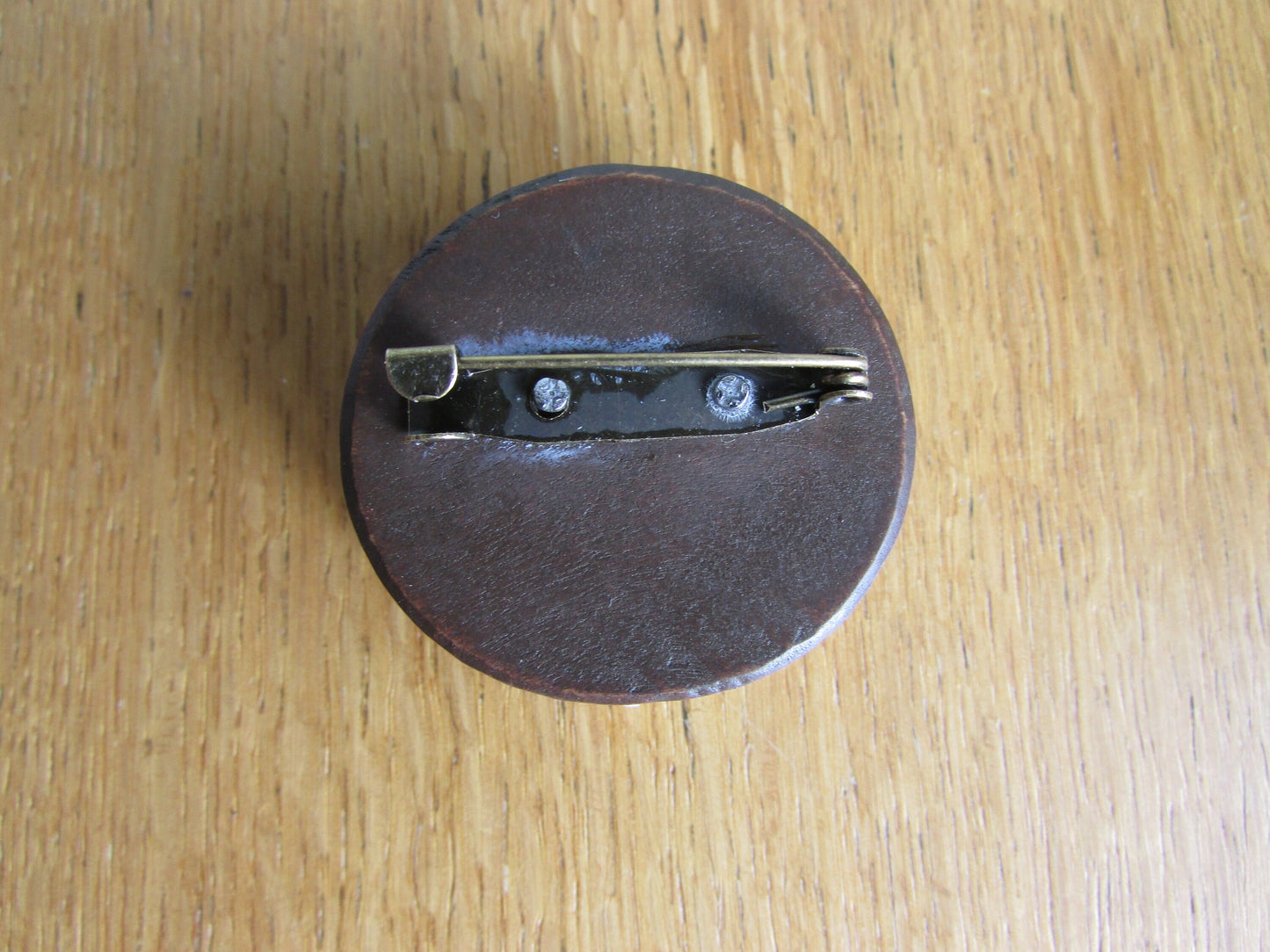 Home-made brooch using vintage plastic ships wheel and vintage wooden round bead