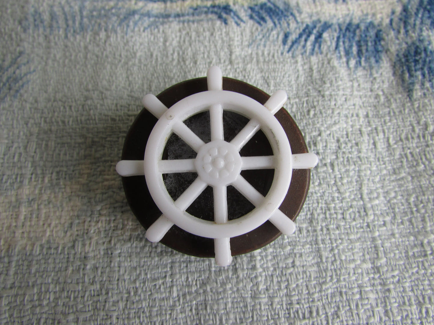 Home-made brooch using vintage plastic ships wheel and vintage wooden round bead
