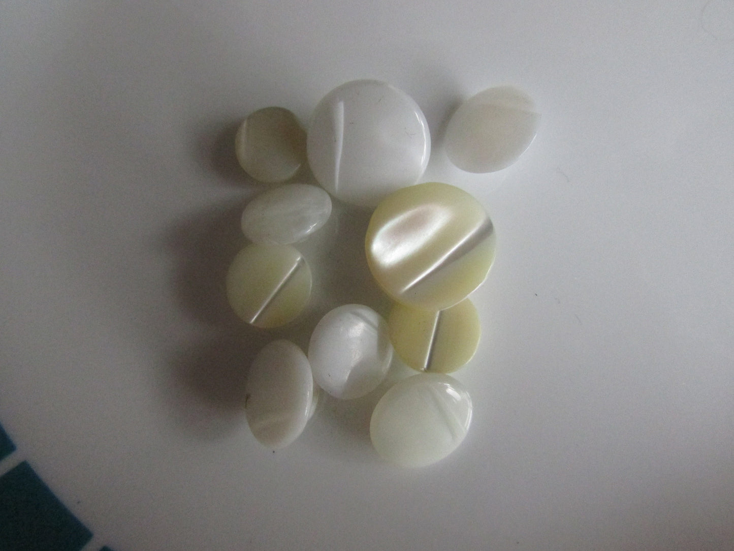 12 small vintage white, & cream glass round buttons