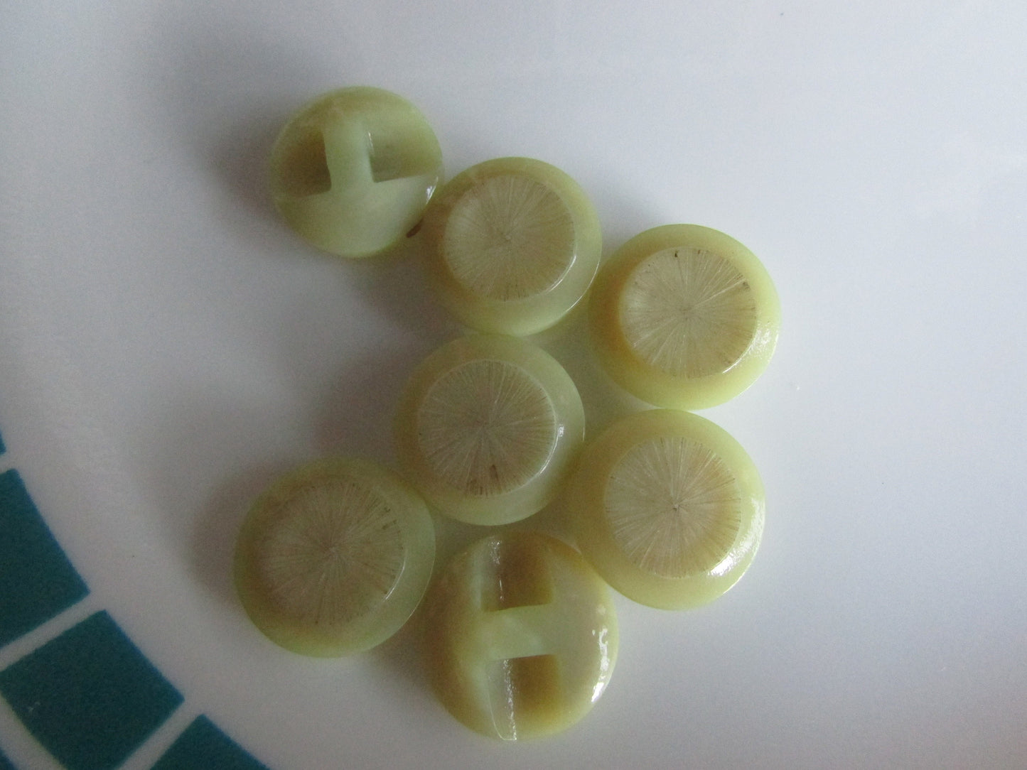 7 vintage engraved citrine-coloured round glass buttons