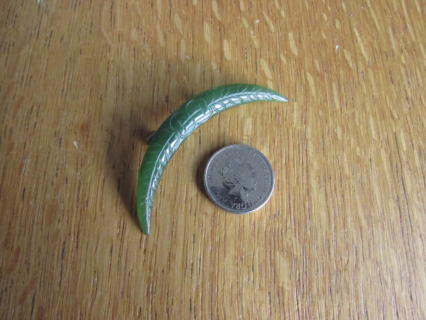 Home-made brooch using vintage carved jade crescent