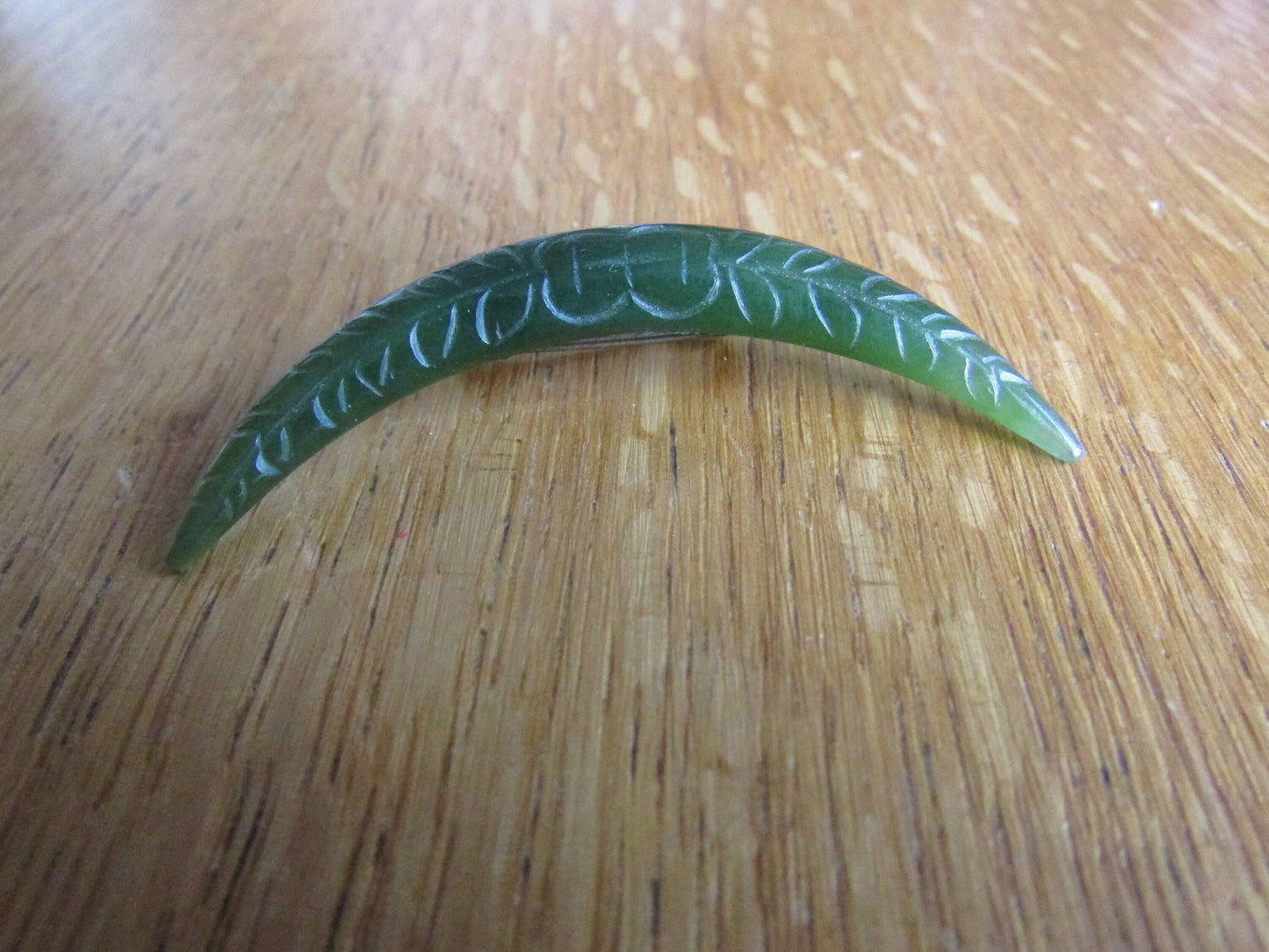 Home-made brooch using vintage carved jade crescent