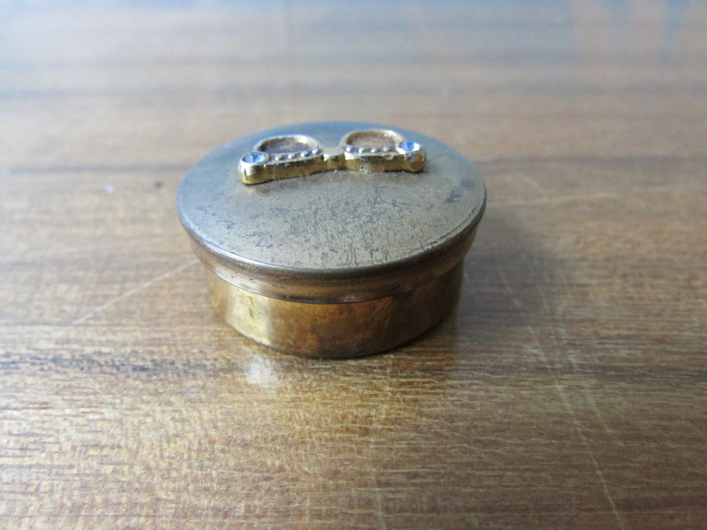 Small vintage brass-tone pill box, cute diamanté specs details